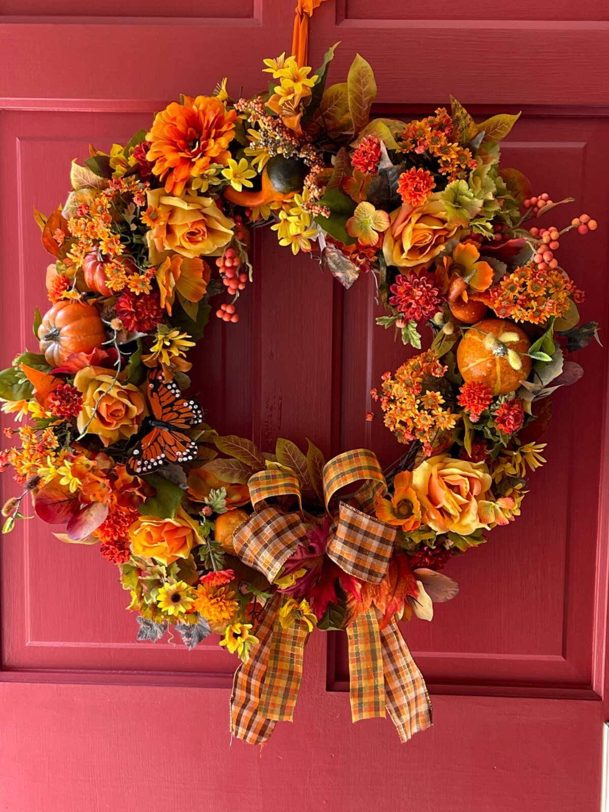 A Fall Wreath in all Shades of Orange with Plaid Ribbon and Bow