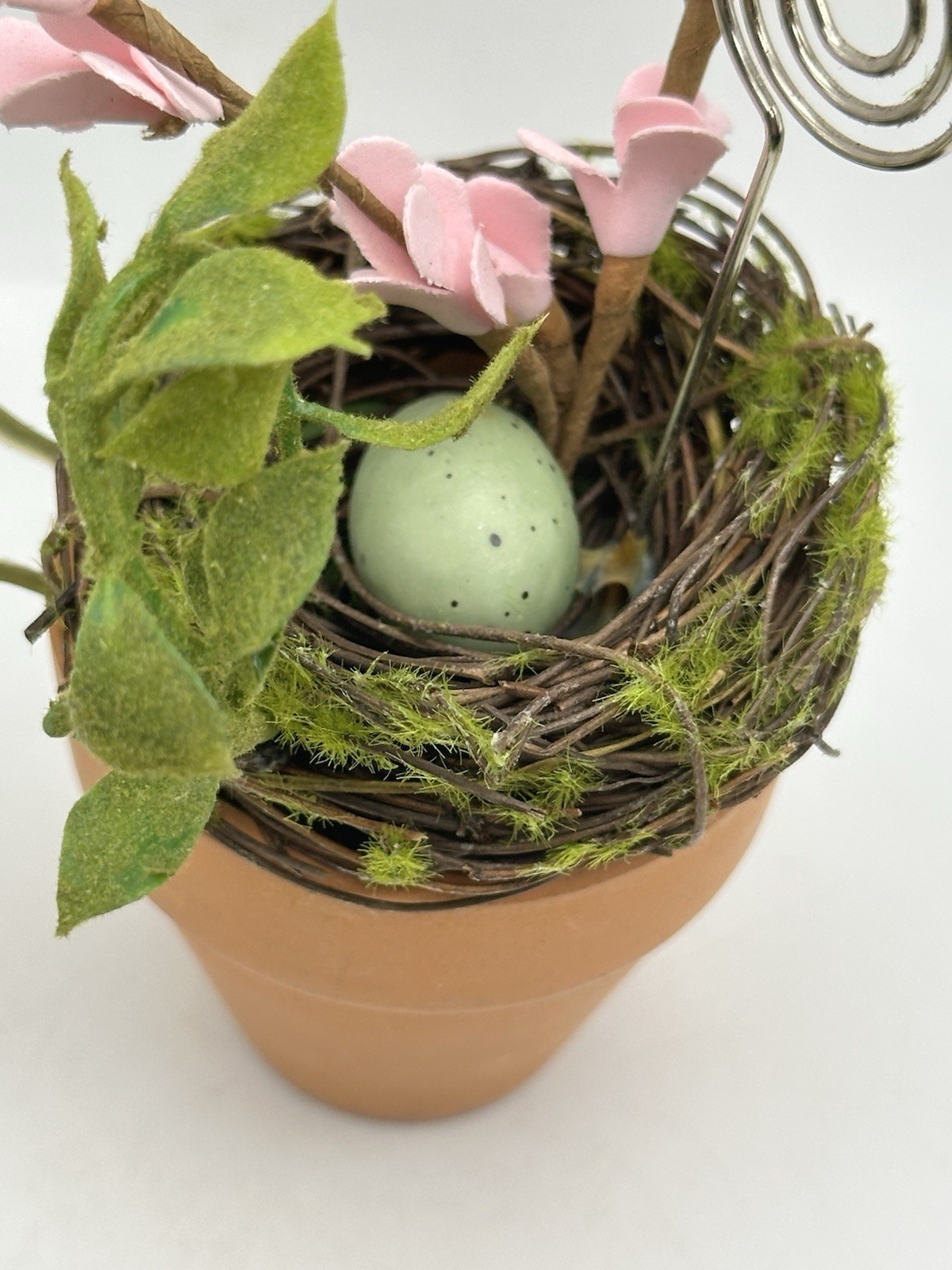 Photo Holder In Spring Themed Pot With Birds Nest Egg Flowers And Foliage