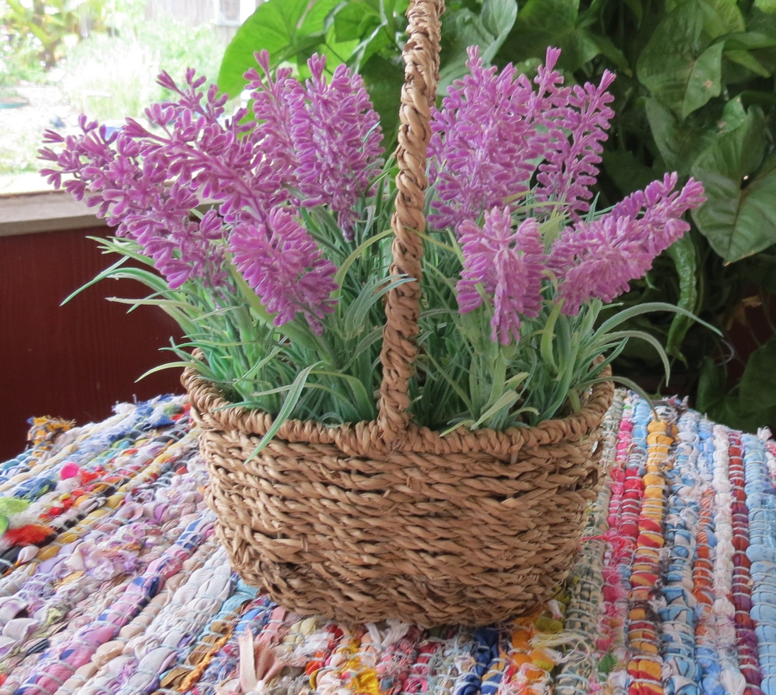Lavender faux flowers in basket 18 ” around 4″ high 7″ wide