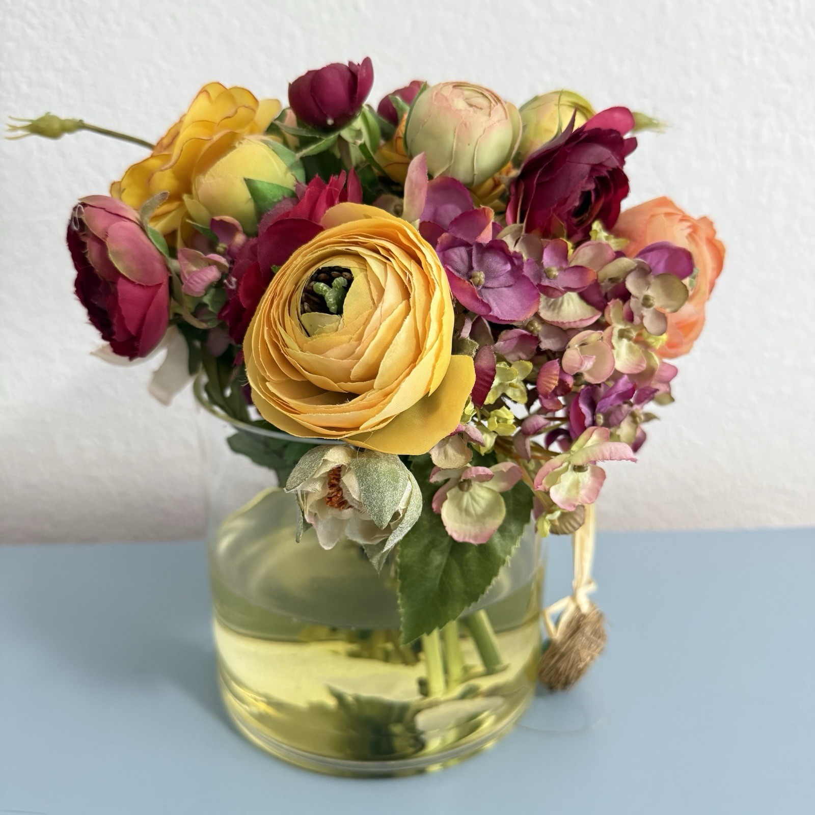 Beautiful Flower Arrangement in Glass Vase with Faux Water.