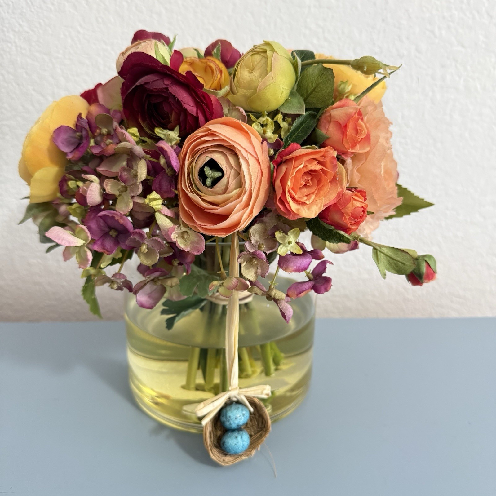 Beautiful Flower Arrangement in Glass Vase with Faux Water.