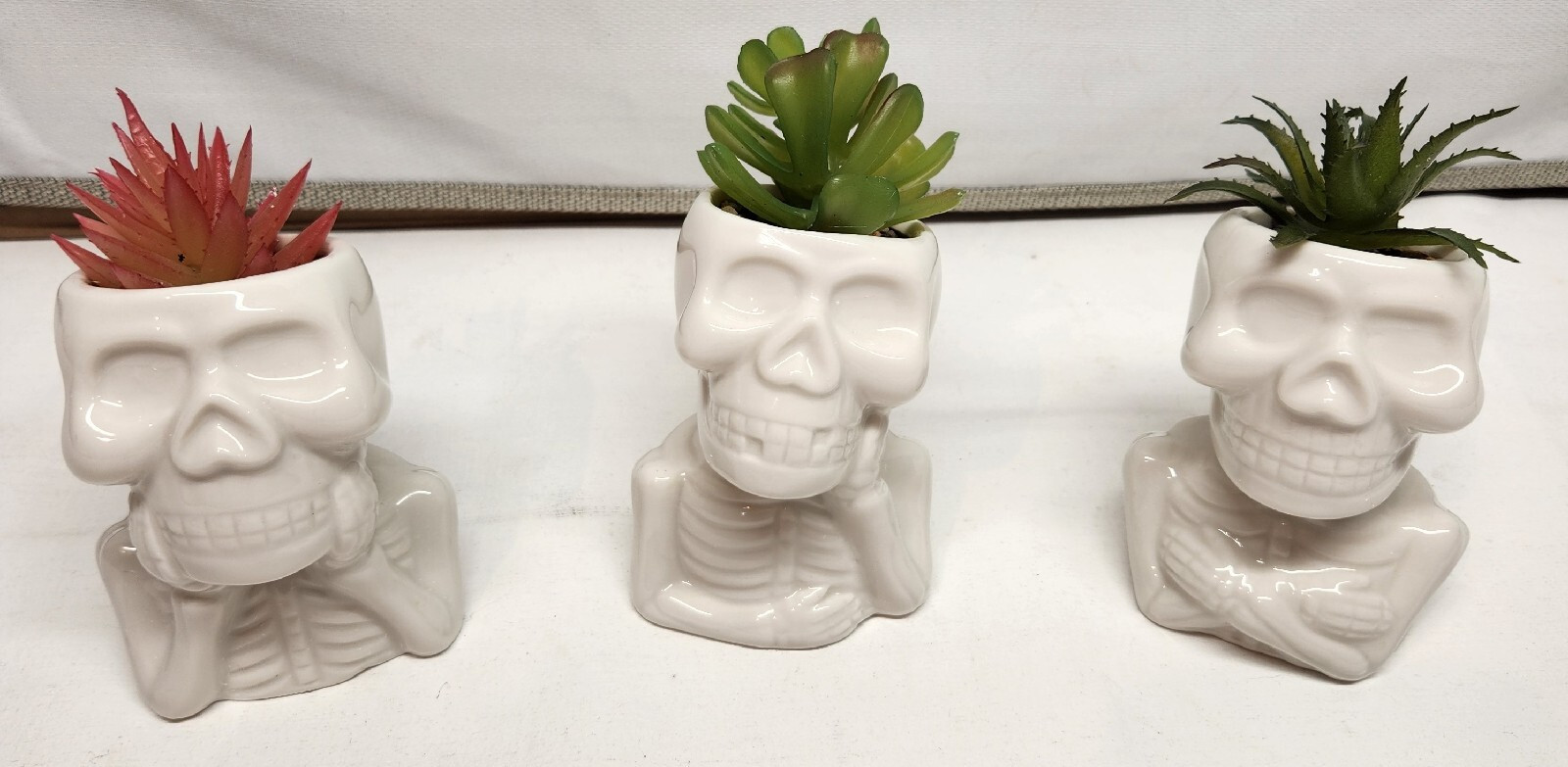 unique ceramic skull Faux planters glossy white finish playful skeleton design