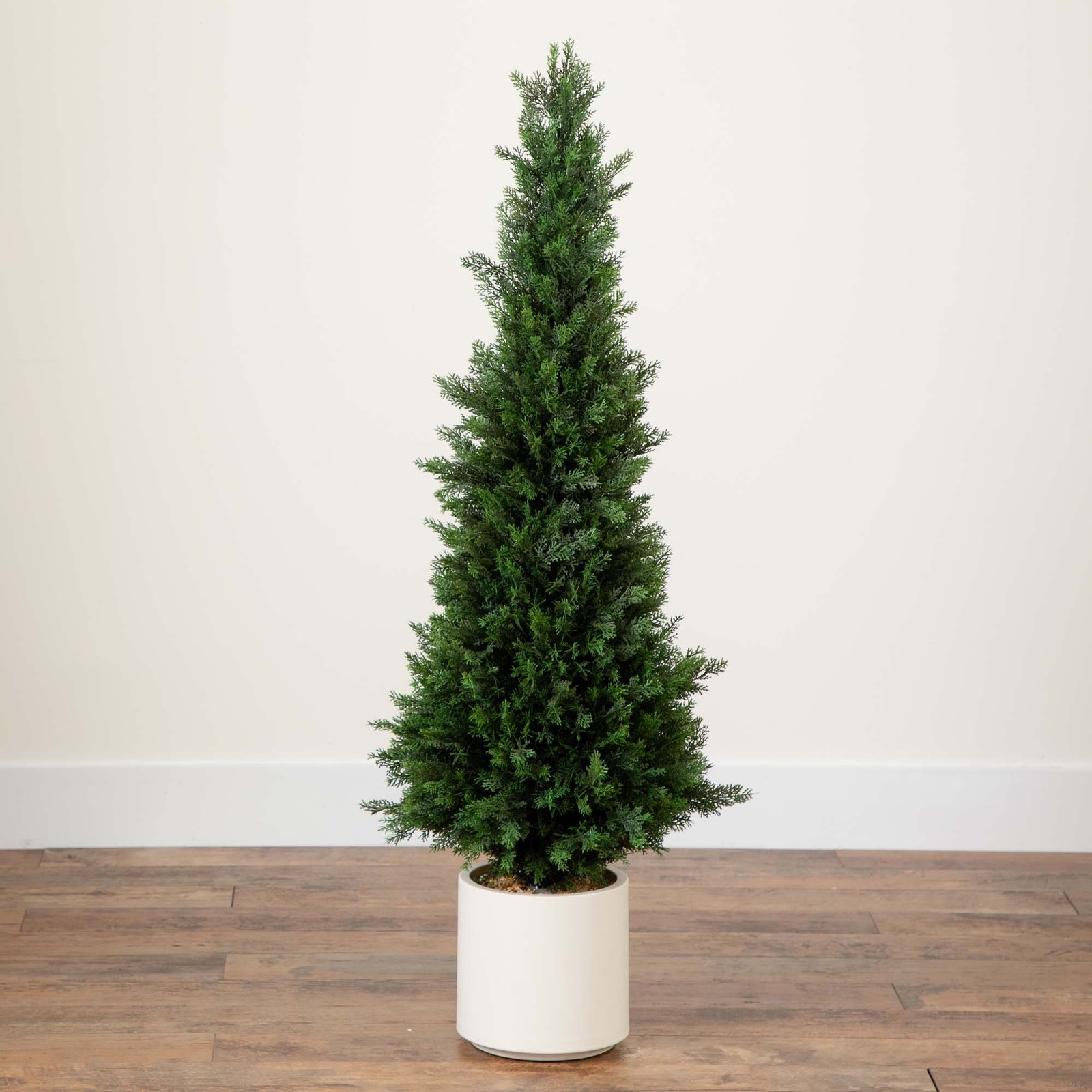 Nearly Natural 4ft UV Resistant Cedar Tree in White Planter in Green