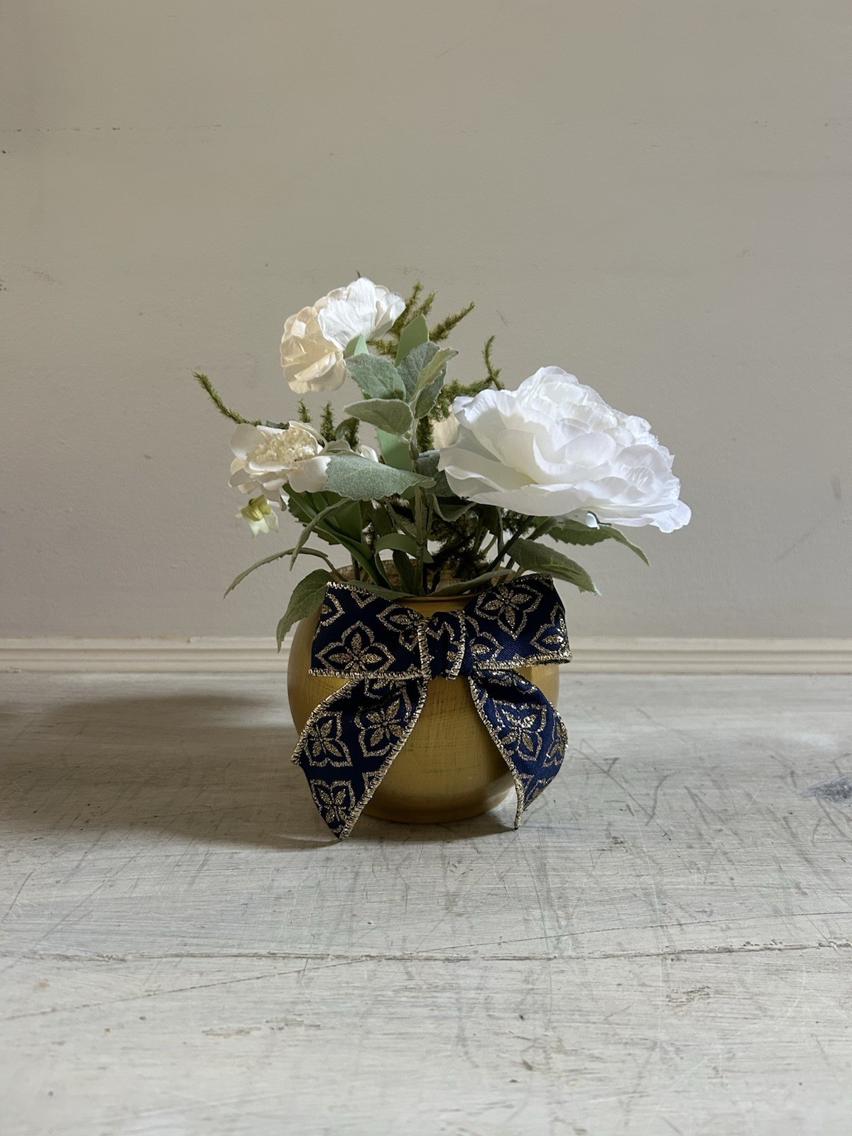 Sage Green White And Gold Floral Arrangement With Navy And Gold Bow