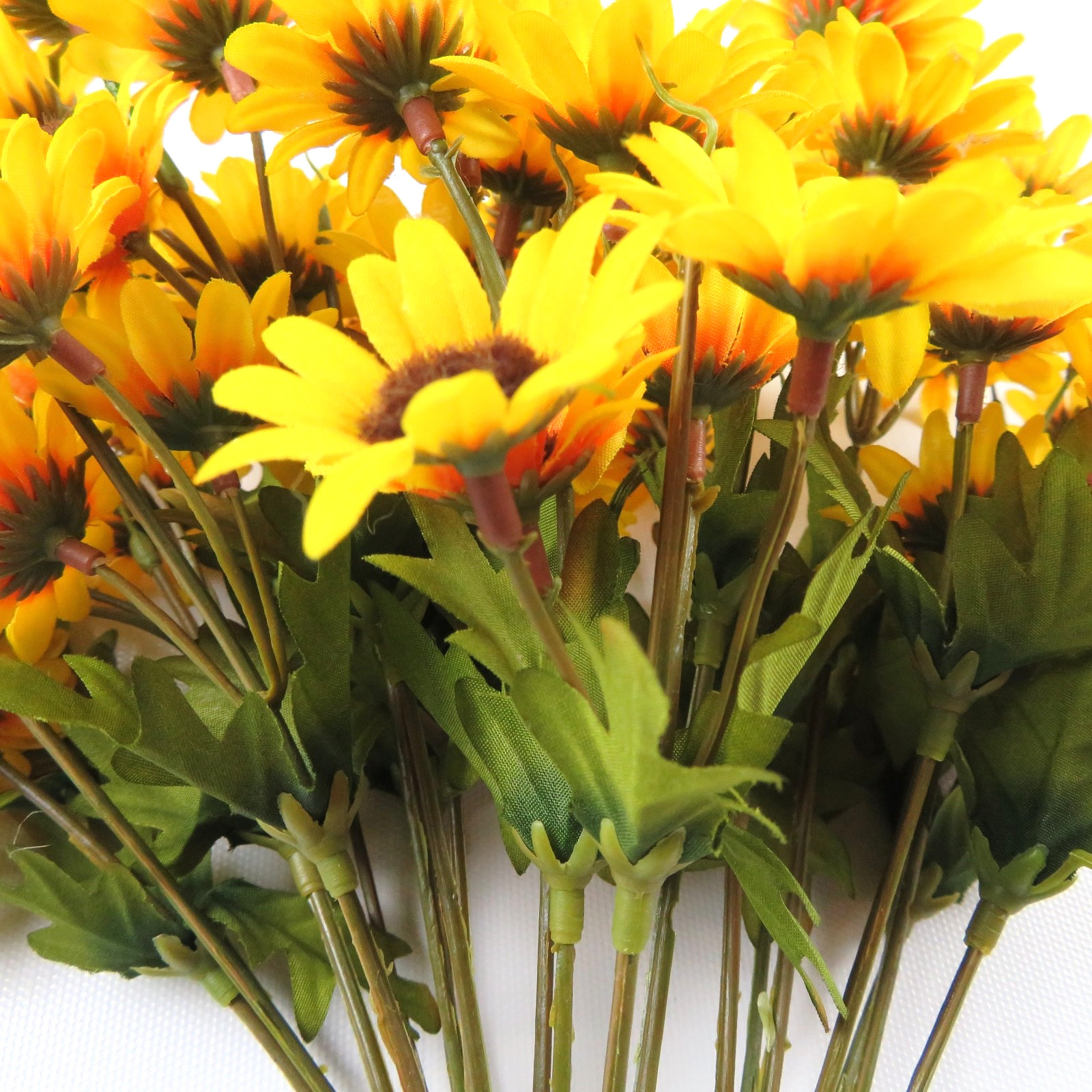Mixed bouquet of artificial flowers, yellow & orange daisies, blue, 7 bundles