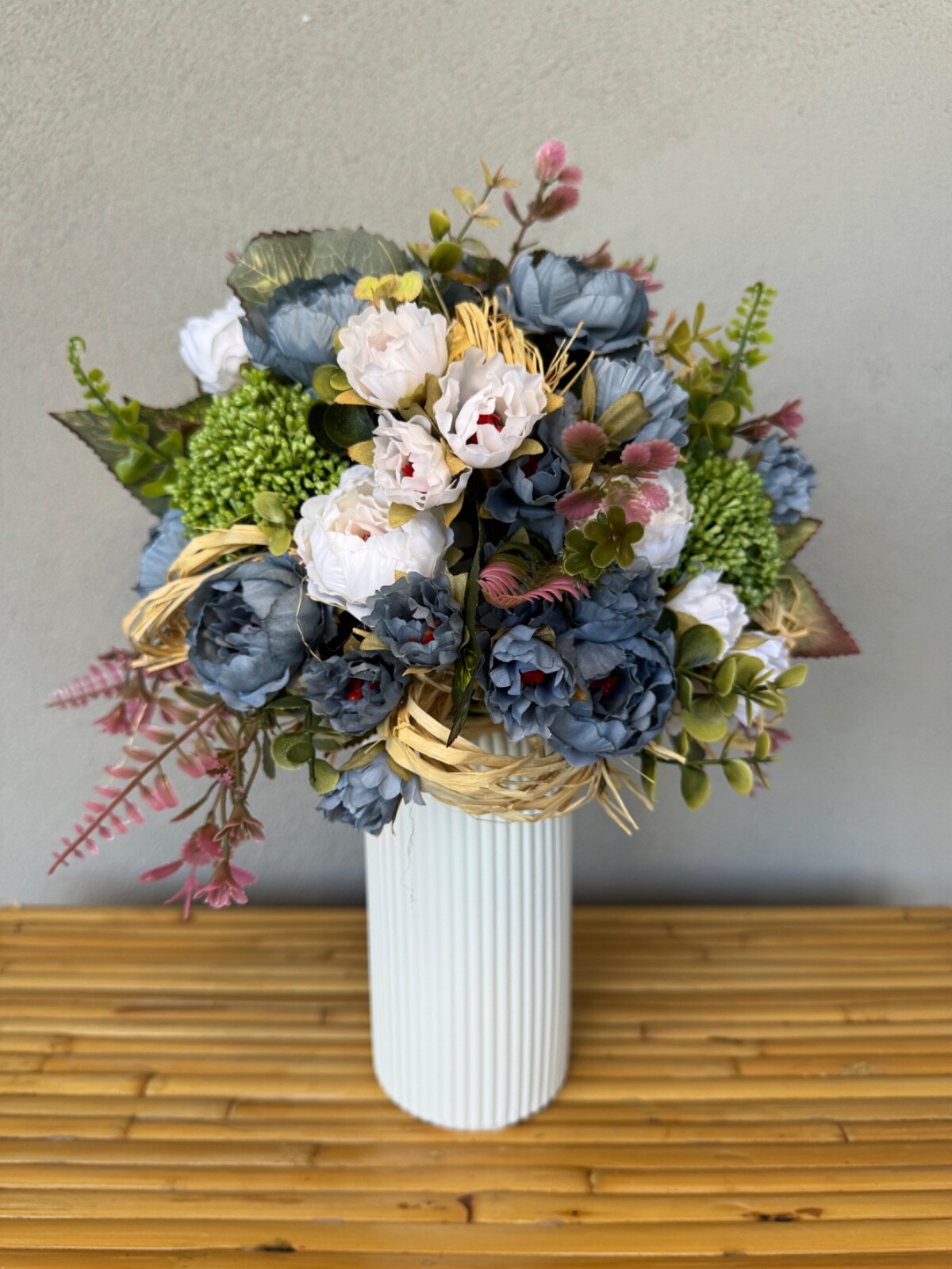 Blue and white flower arrangement in a vase , width 12’, height 15’, home decor.