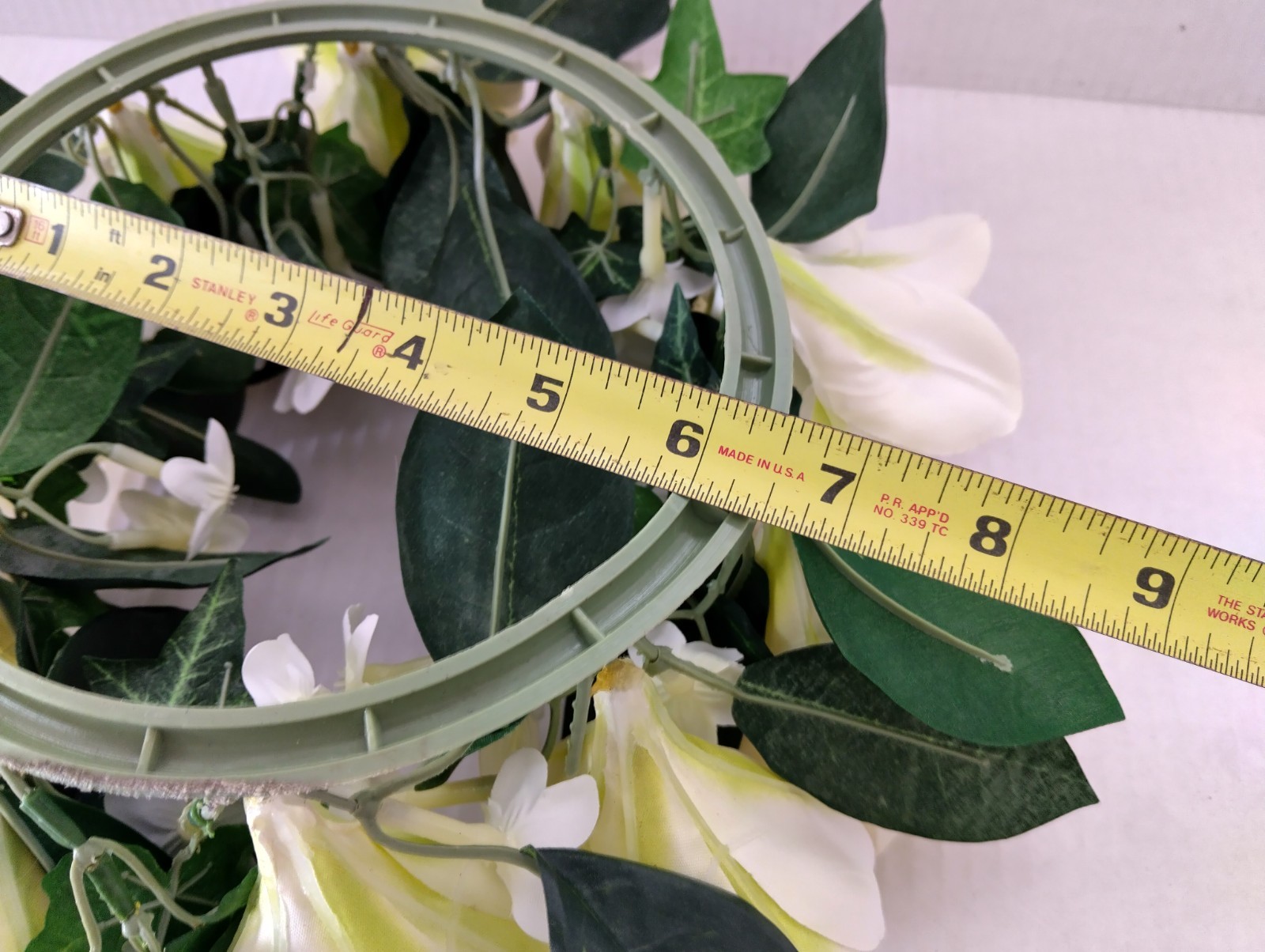 Amaryllis candle ring for a 6″ pillar candle or cremation urn.