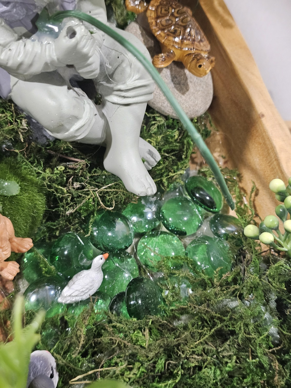 Artifical Flower Arramgement in woods, Boy Fishing Deer, Turtle Duck
