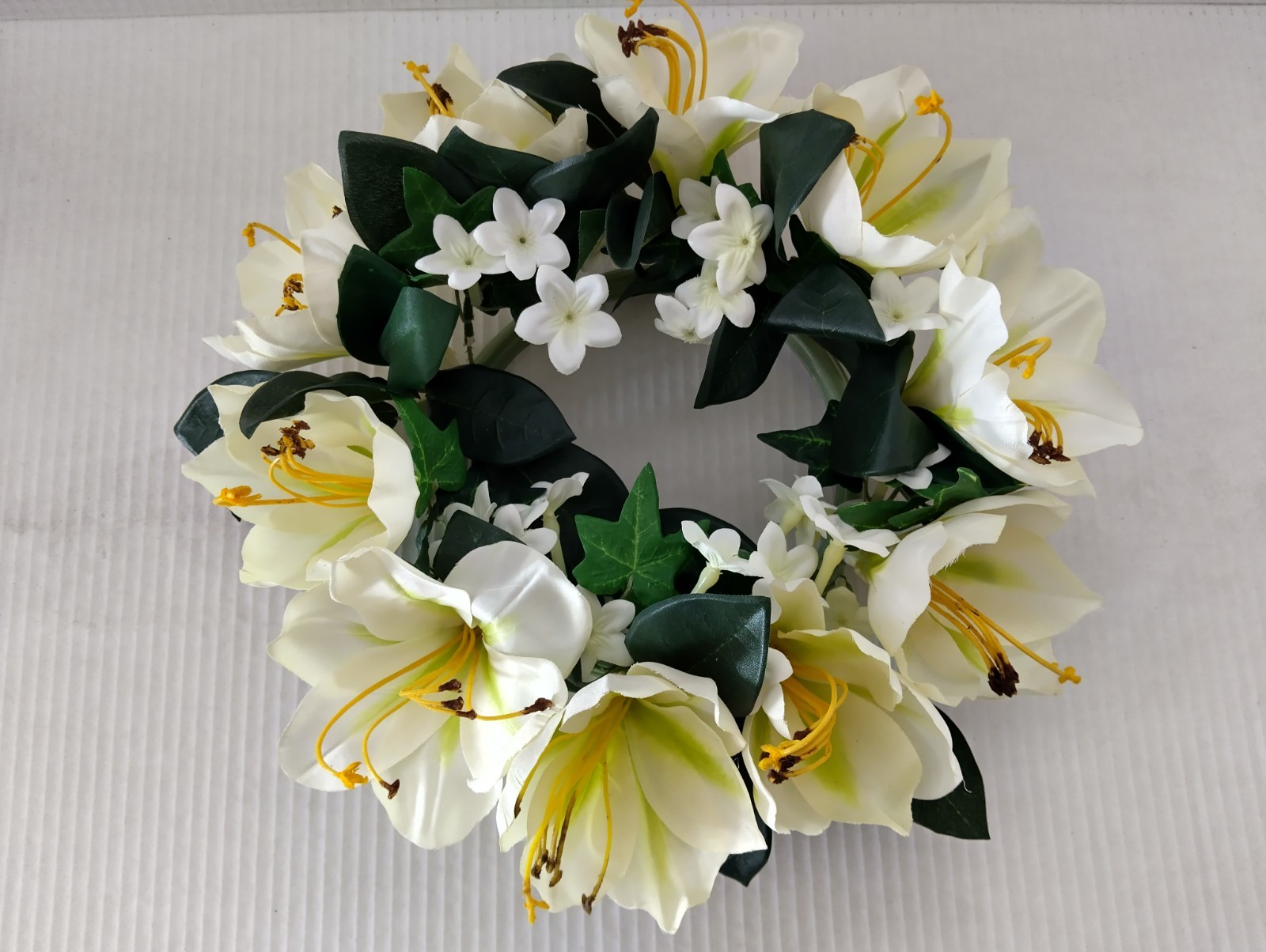 Amaryllis candle ring for a 6″ pillar candle or cremation urn.