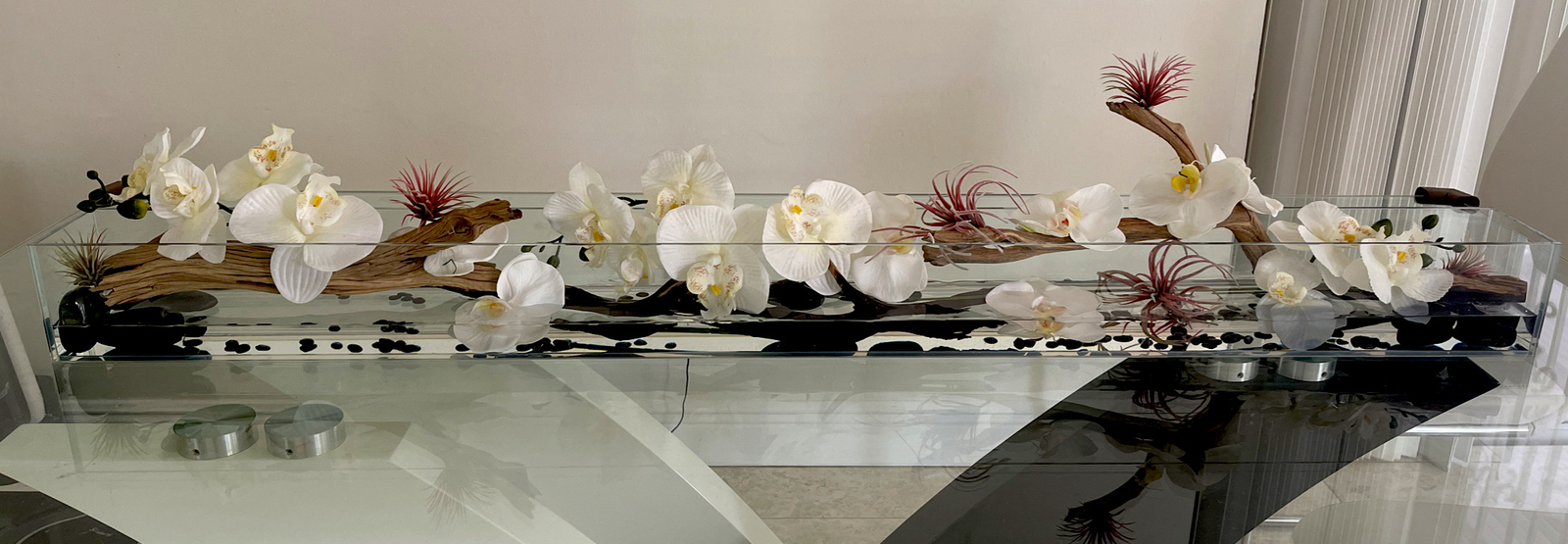Silk orchid floral arrangement in rectangular glass vaseorchids arrangements48”