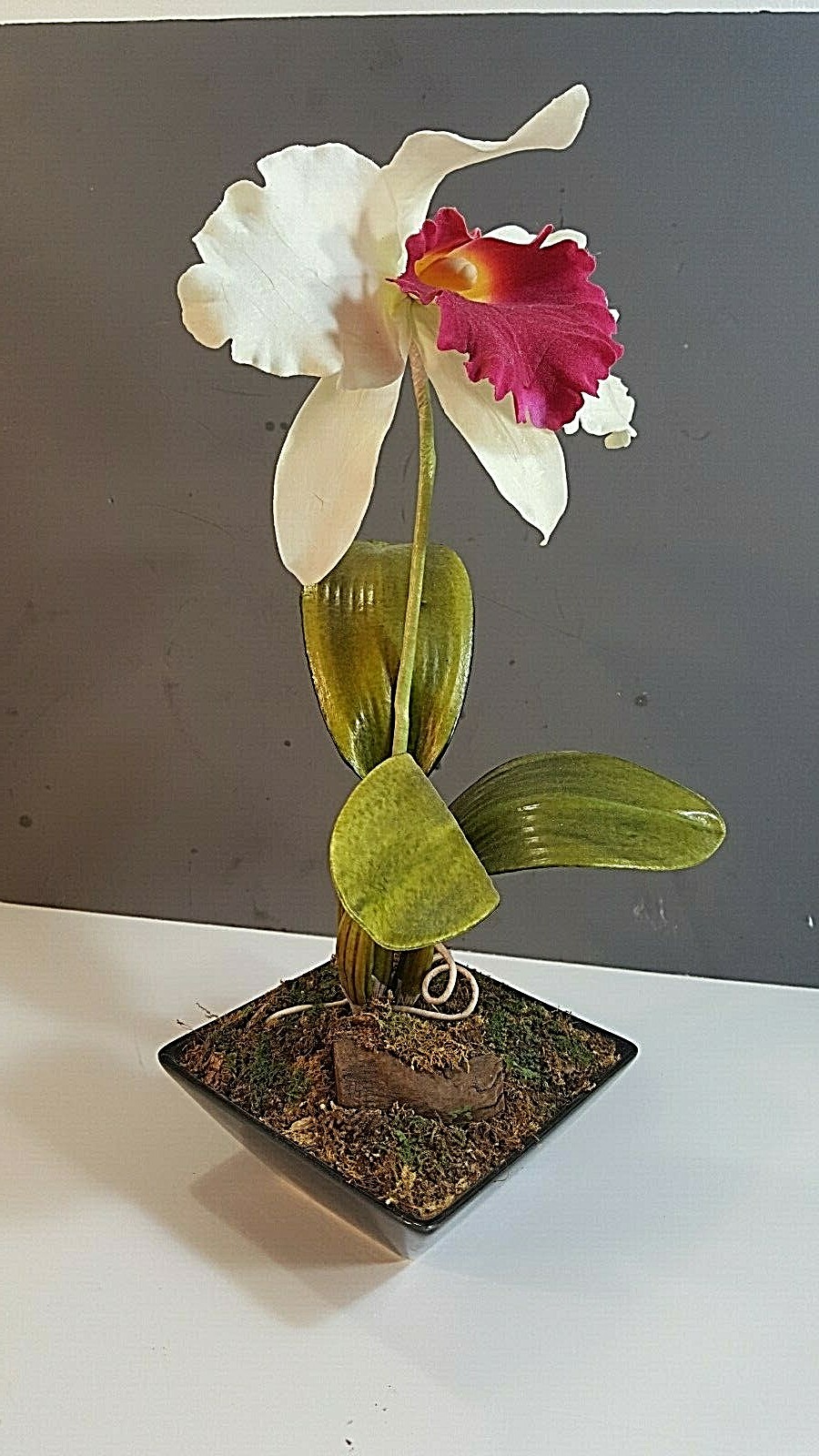 ARTIFICIAL RED & WHITE ORCHID IN A BLACK CERAMIC PLANTER