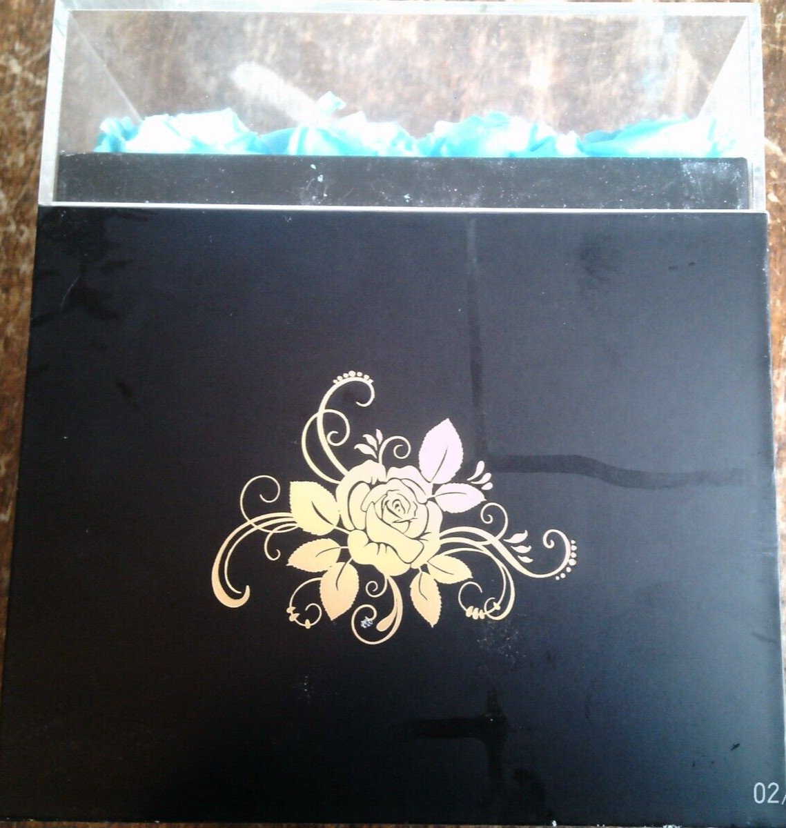 16 aqua preserved roses in (approx.) 6.5 x 6.75 x 7.5 inch black box PLEASE READ