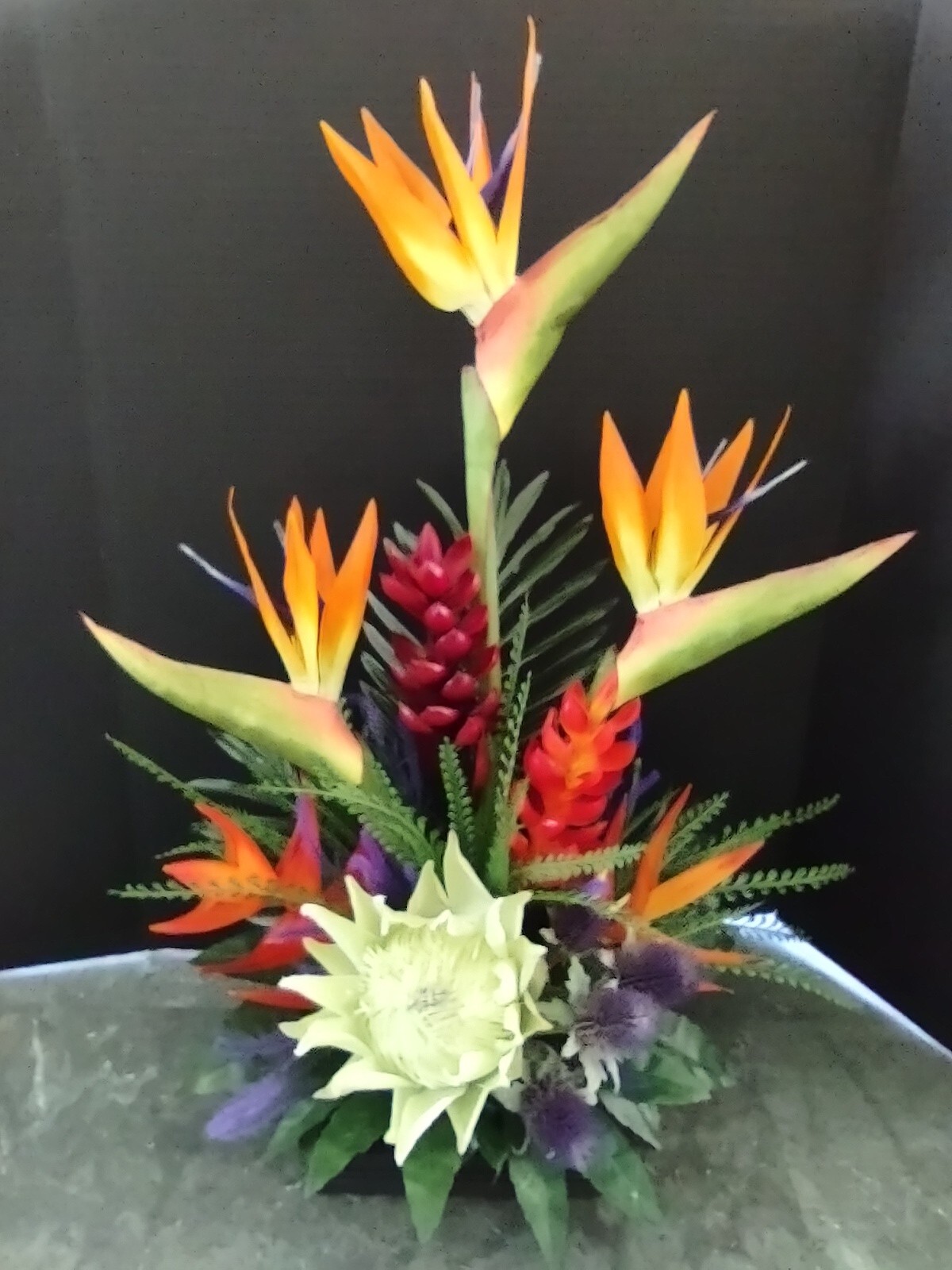 Artificia ltropical floral arrangement