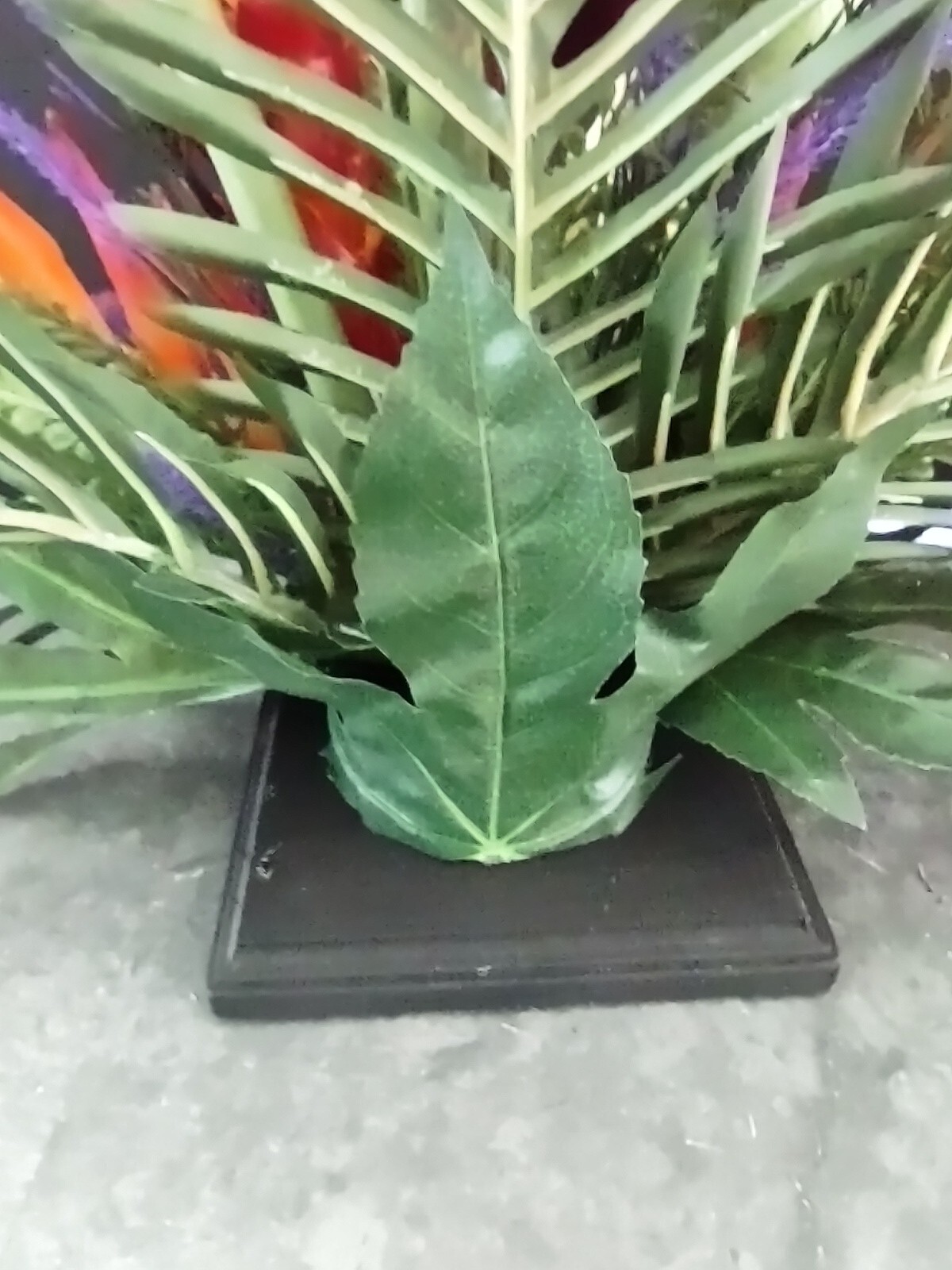 Artificia ltropical floral arrangement