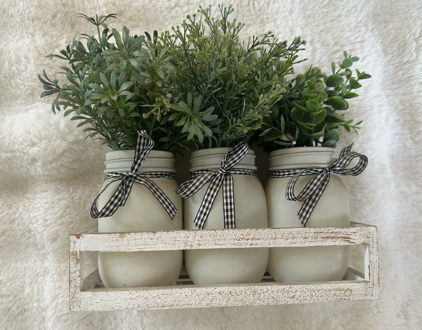 Artificial Eucalyptus Arrangement in White Mason Jars with Ribbon on Wooden Tray