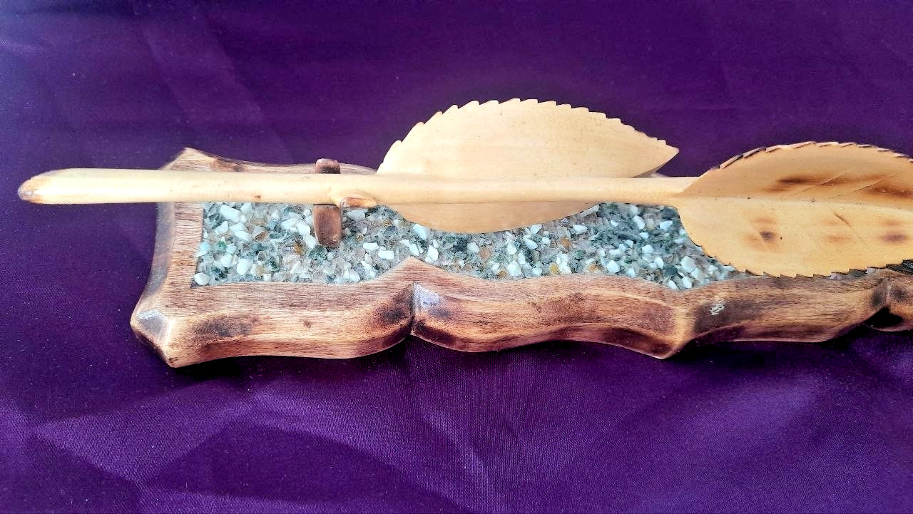 natural wood rose on a stand with hand-carved stones.