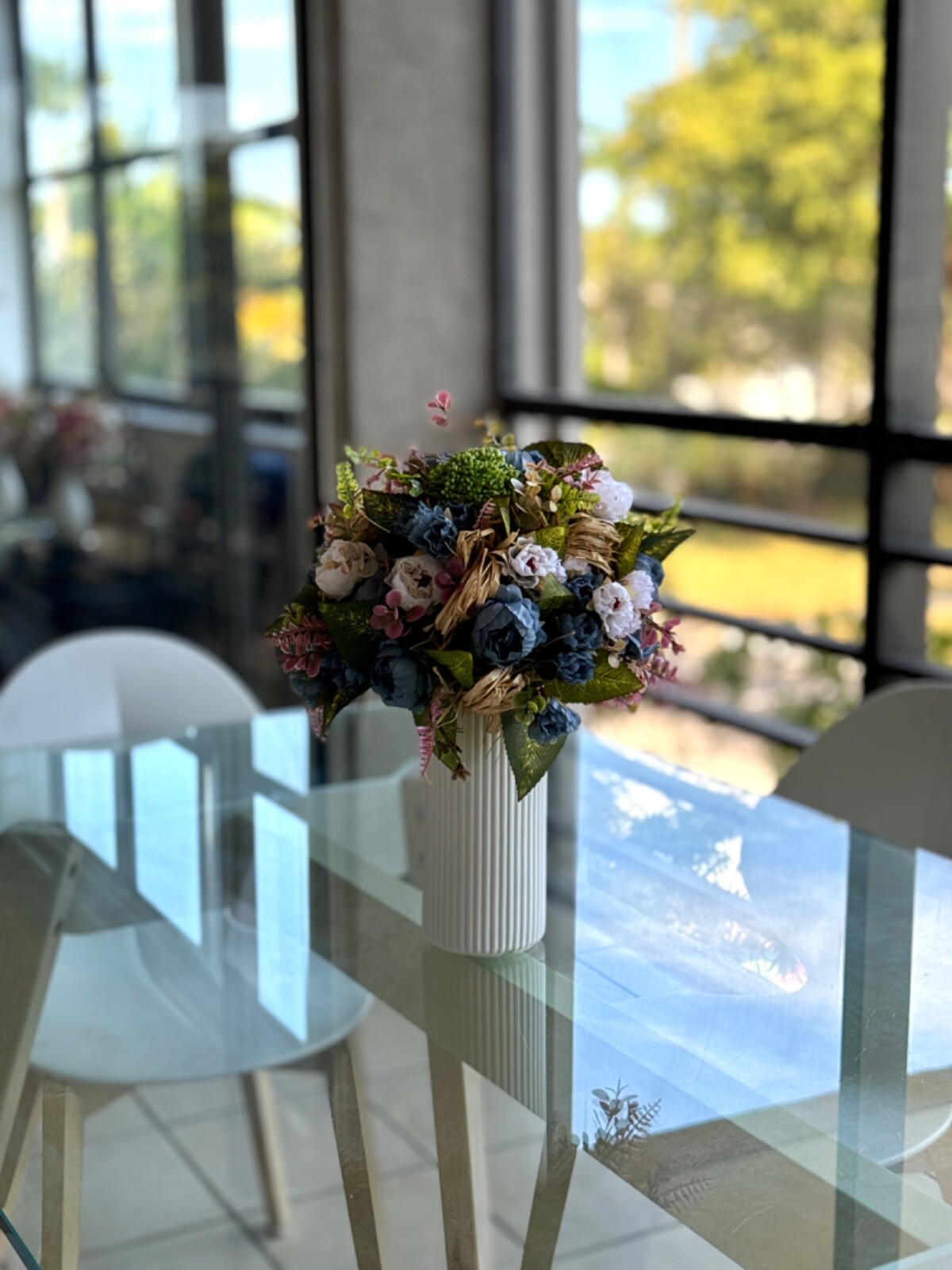 Blue and white flower arrangement in a vase , width 12’, height 15’, home decor.