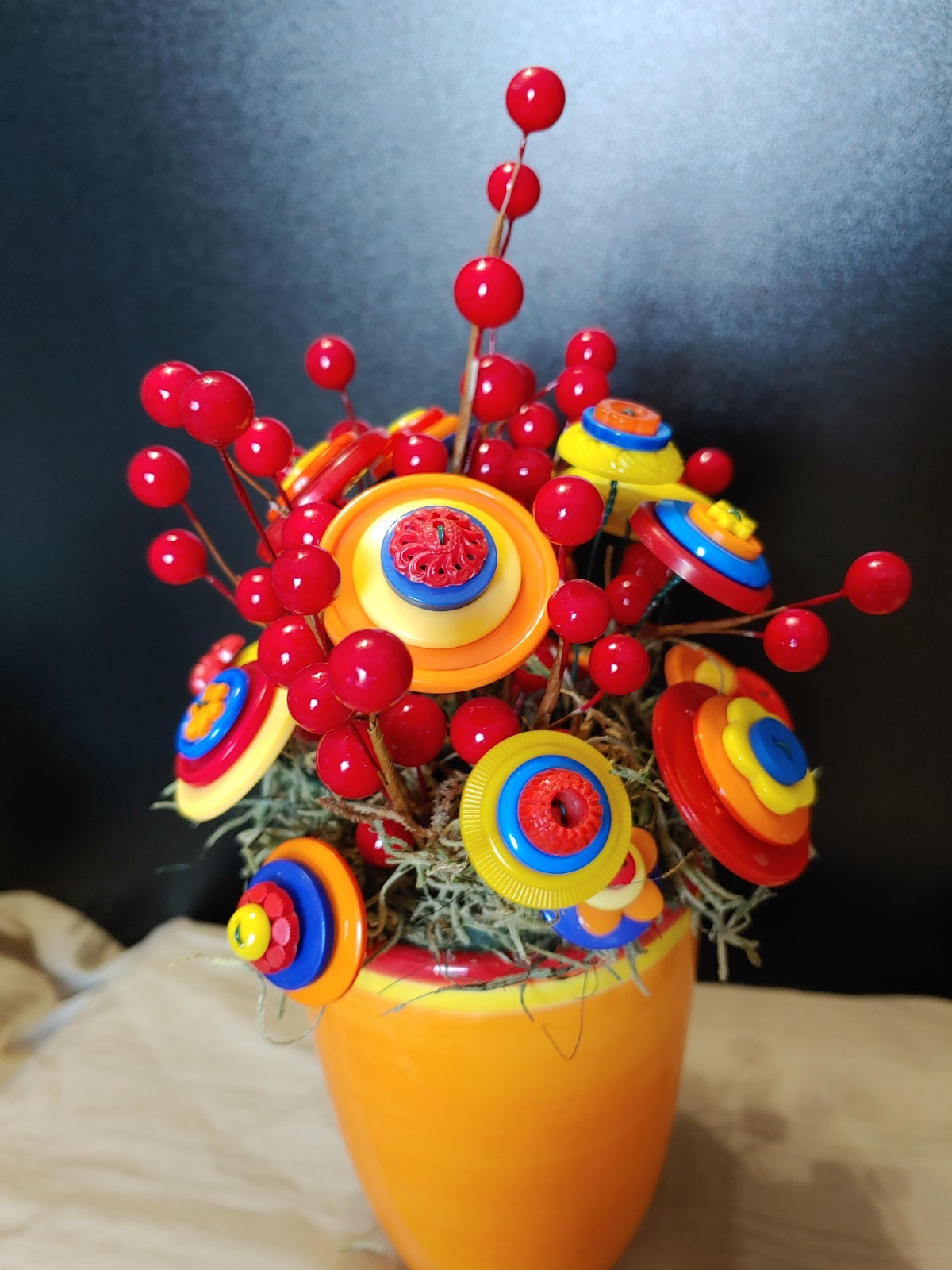 Bright Button Bouquet in Orange Coffee Mug. Red, orange, yellow. fun and playful
