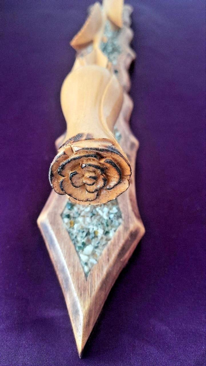 natural wood rose on a stand with hand-carved stones.
