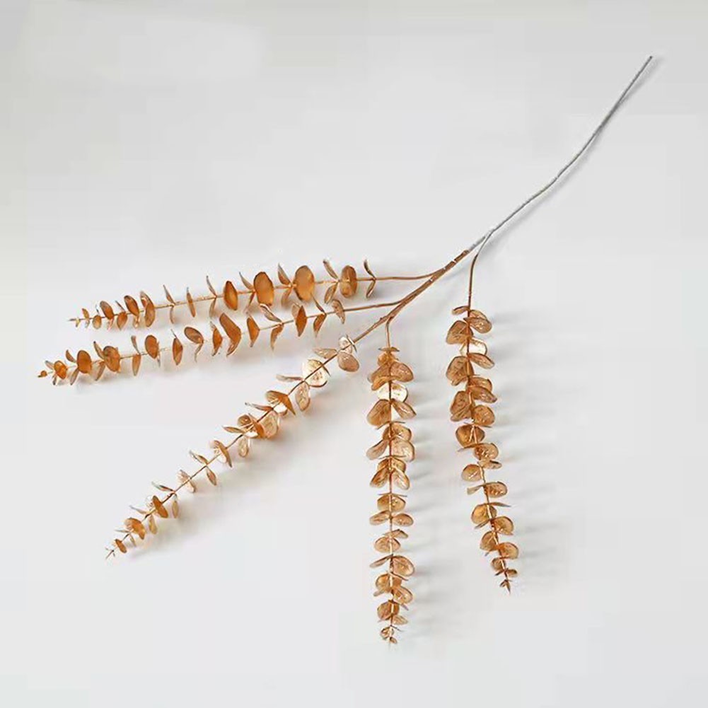 Simulated golden eucalyptus and ginkgo leaf flower arrangement for a chic touch