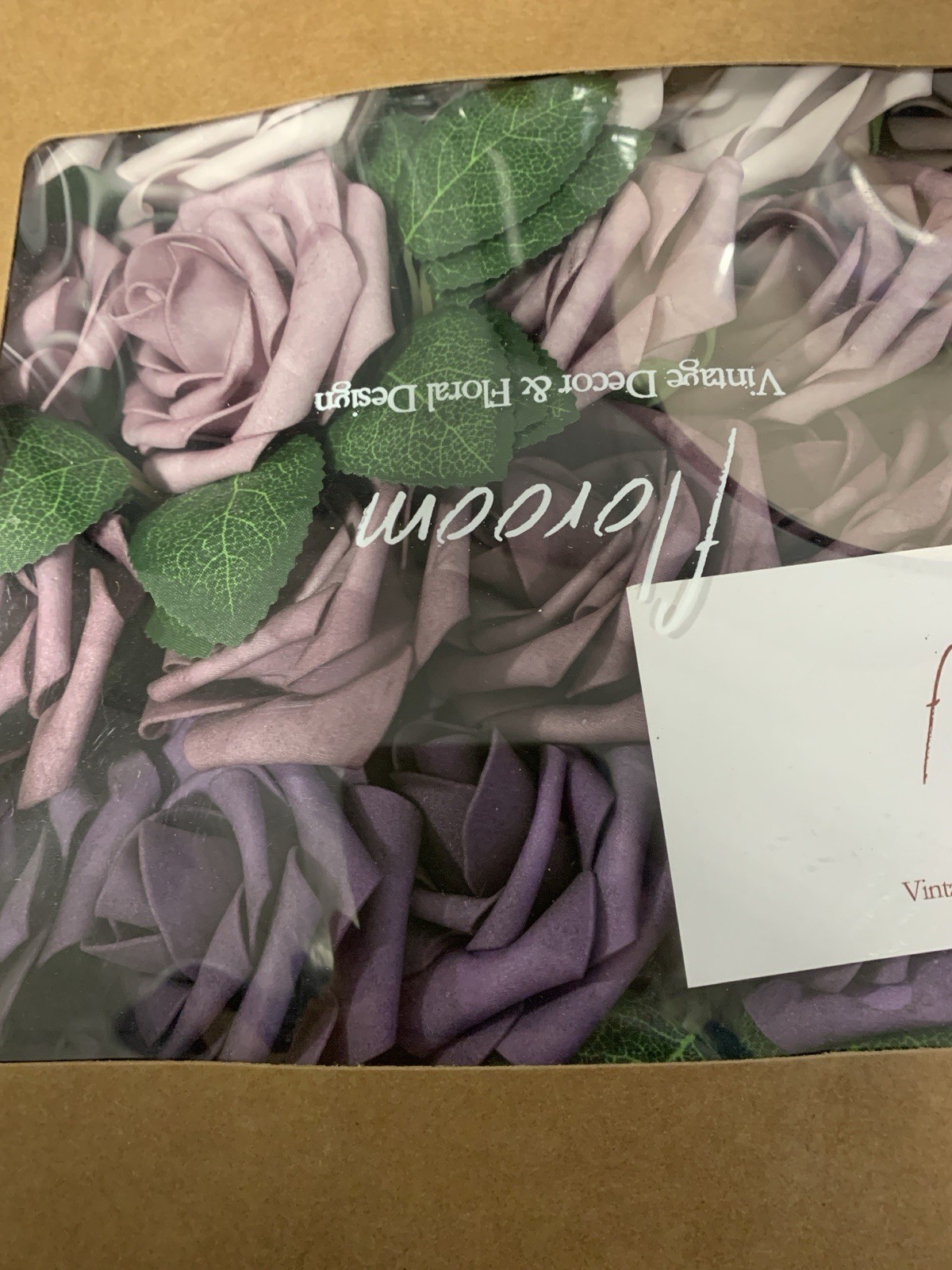 3 boxes of a variety of purple artificial flower heads aprox 3 dozen