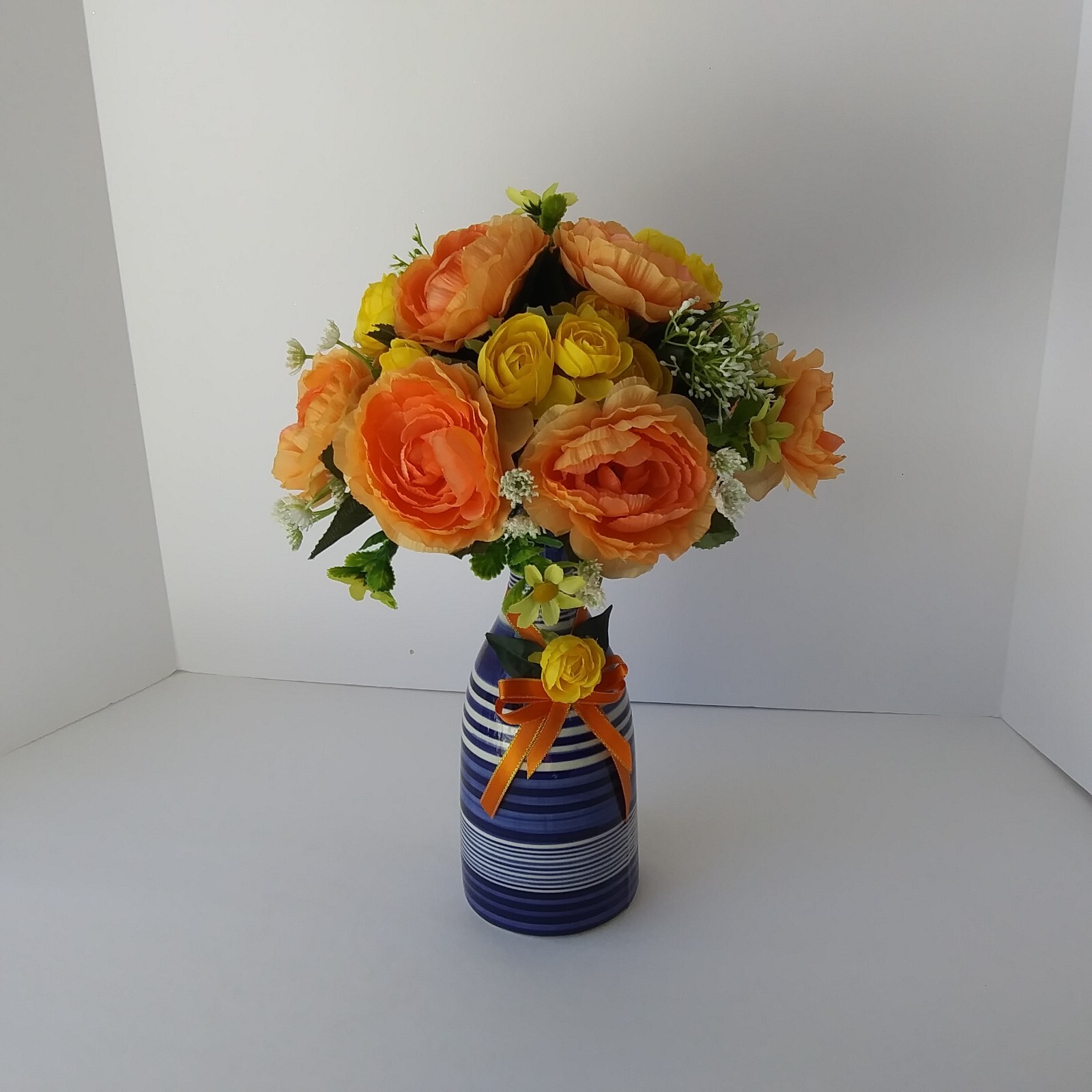 Blue White Striped Pottery Vase with Peach and Yellow Rose Floral Arrangement