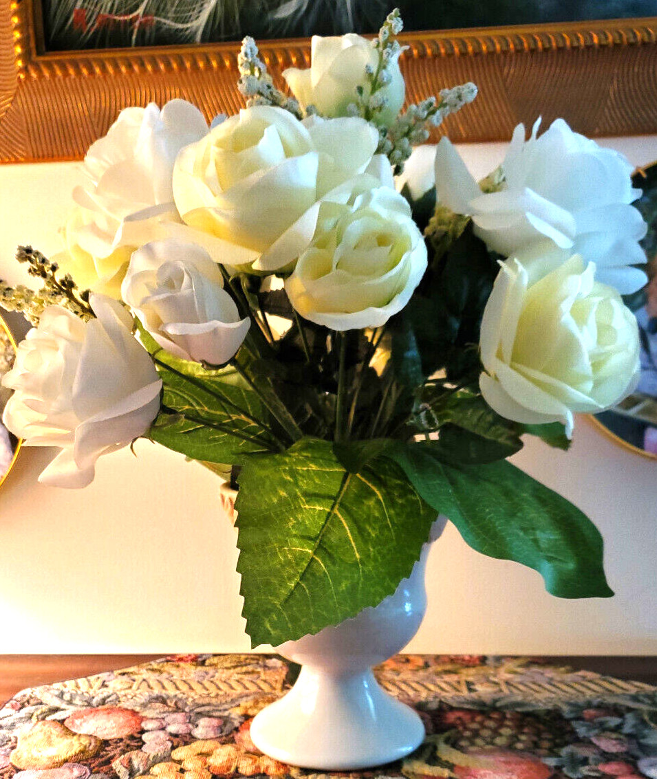 White and pale-yellow silk roses arrangement centerpiece in white vase