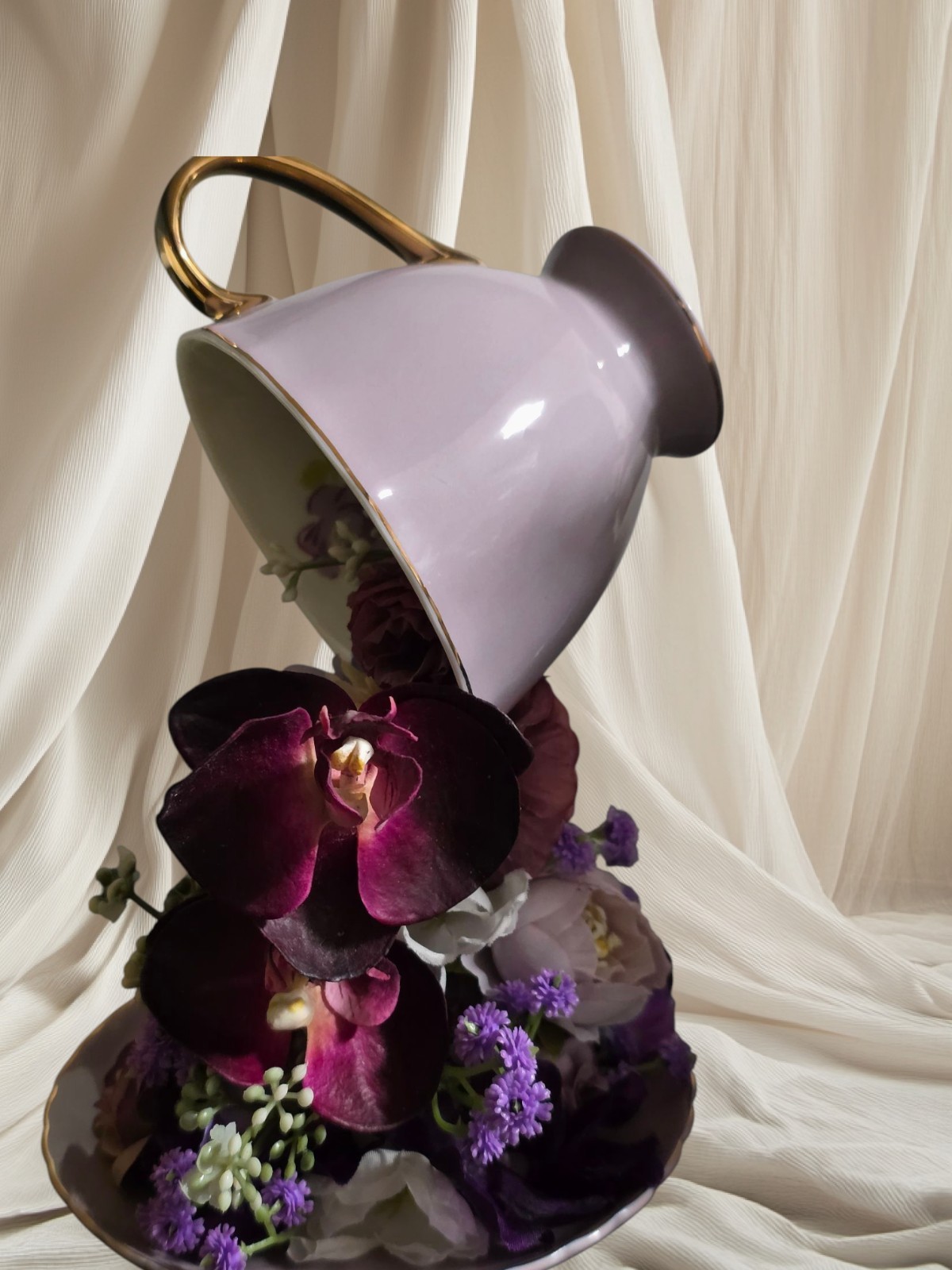 Floating Tea Cup Decorated With Faux Flowers Arrangement