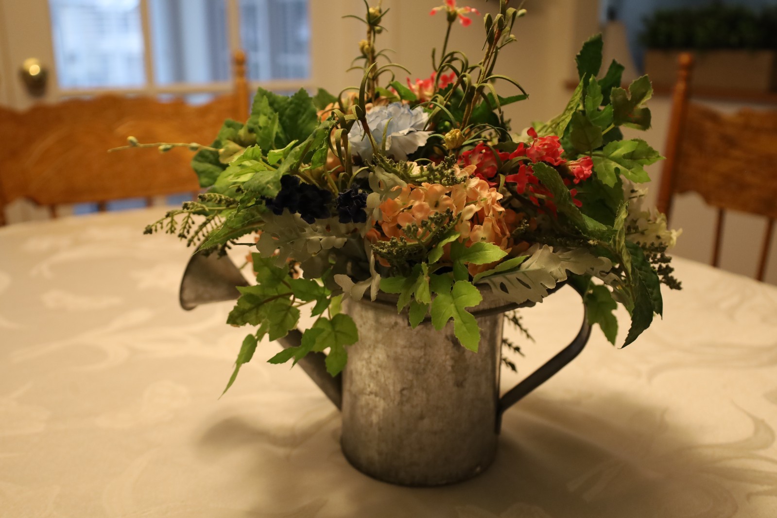 Spring Multicolor Artificial Floral in a Watering Can Table Decoration