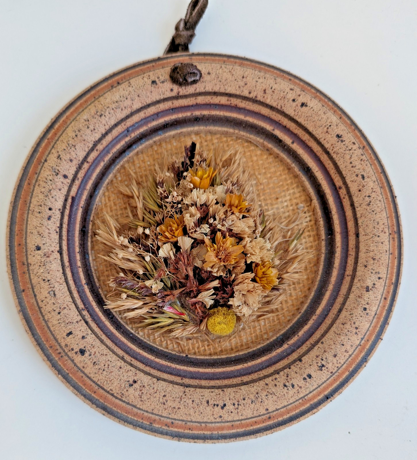 Dried flowers wall hanging round pottery circle speckled floral art boho fall
