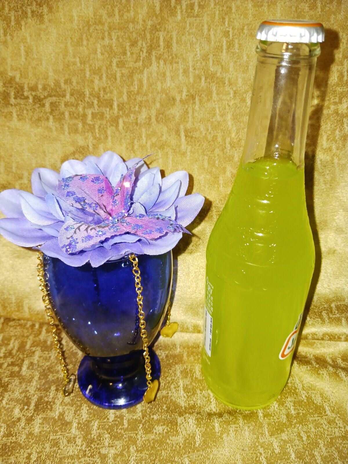 Artificial Flower Arrangement With Blue Glass Vase And Gold Chain Accent /Hearts