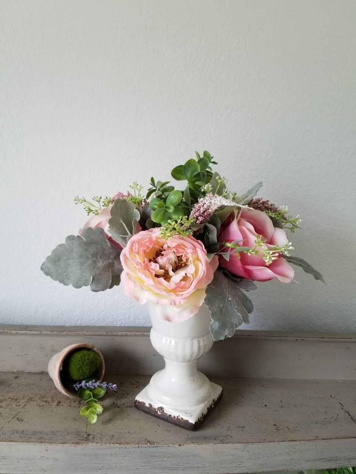 White Urn with faux flowers floral arrangement plants