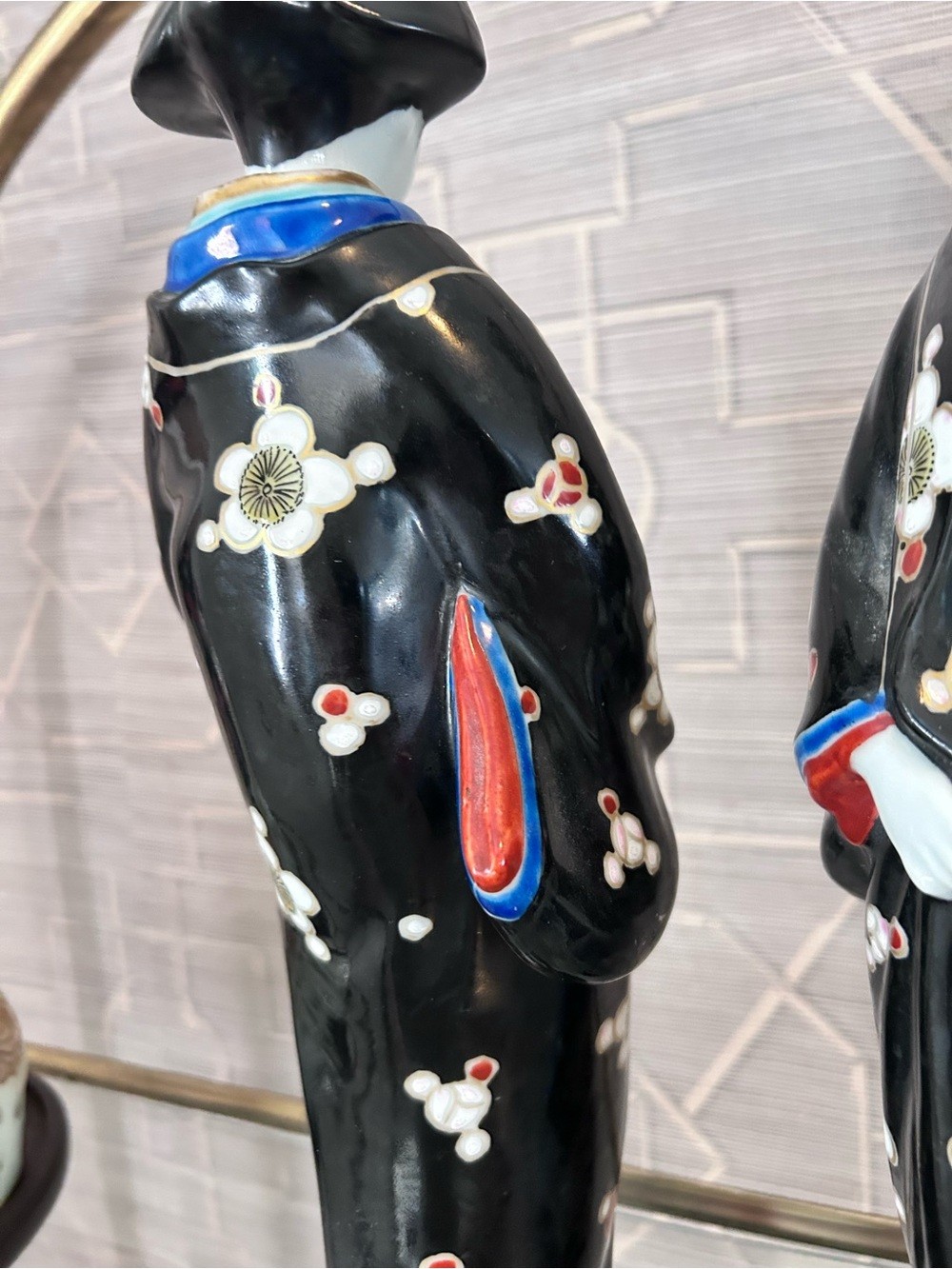 Pair of Black Porcelain Geisha Figurines with Multicolor Accents
