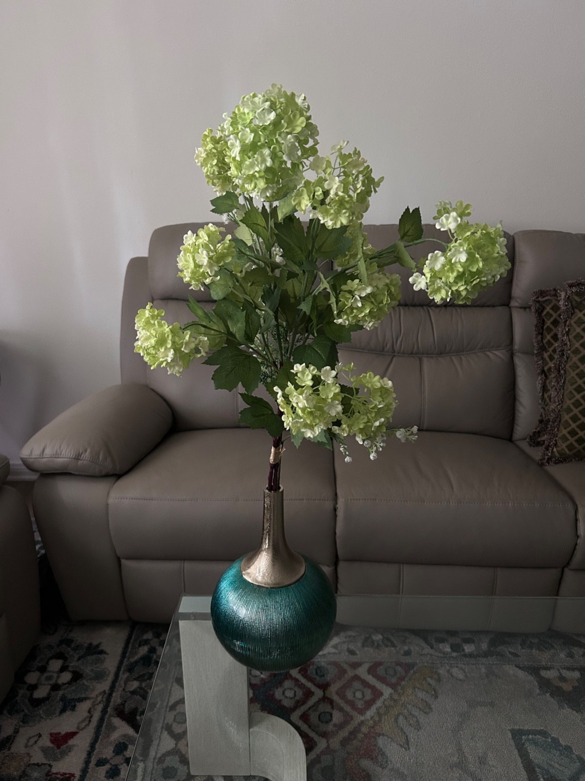 Faux Green Hydrangea stems with bulbous teal and sliver enamel vase