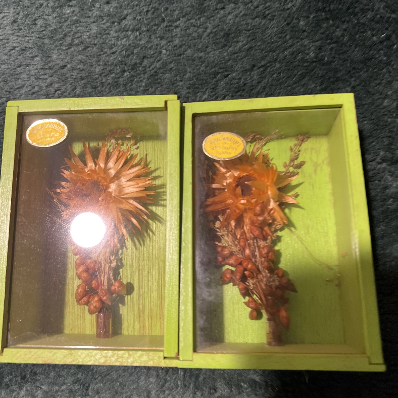 Two Modern Decorative Boxes Containing Dried Orange Flowers and Seed Pods. New
