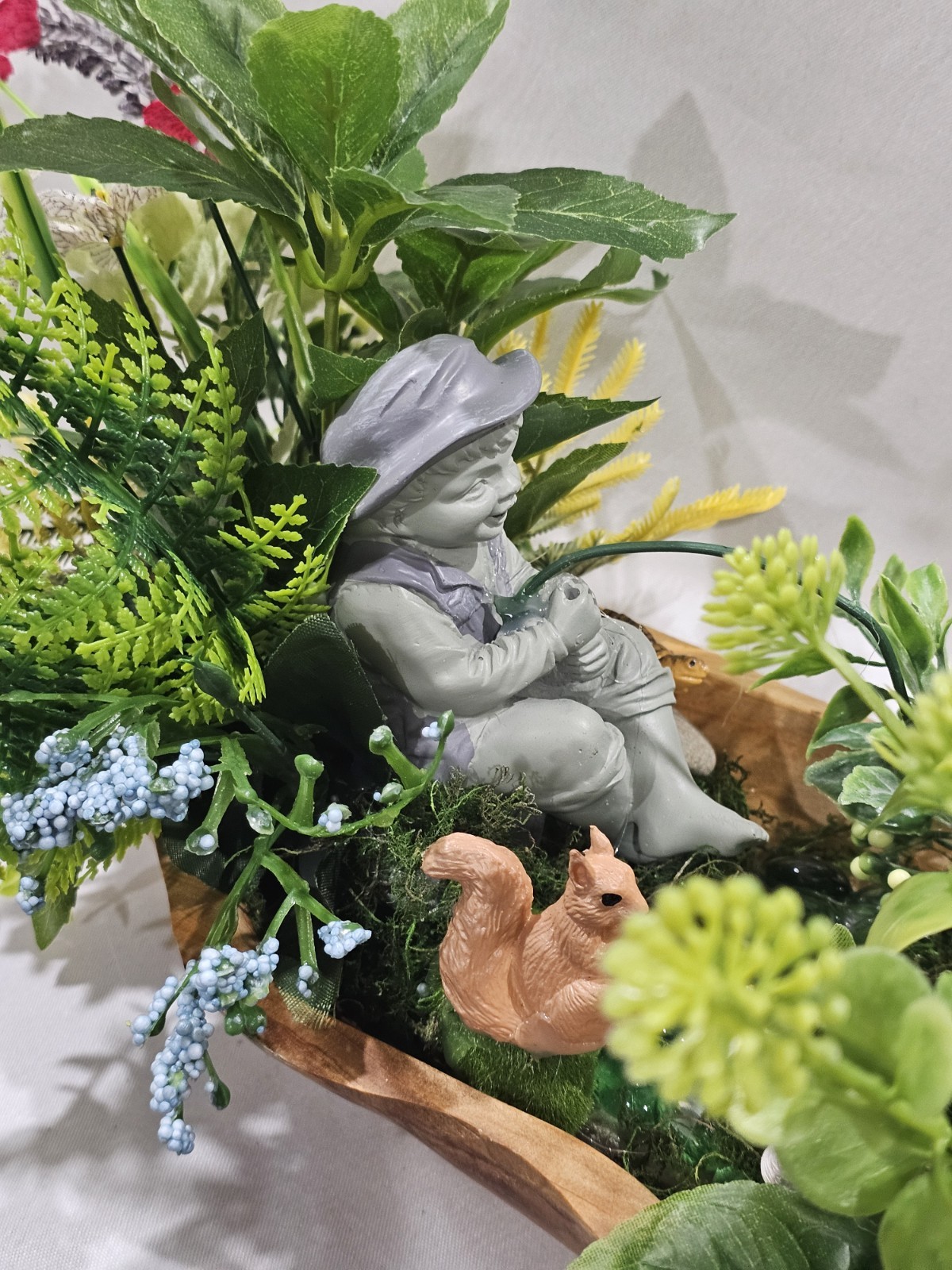 Artifical Flower Arramgement in woods, Boy Fishing Deer, Turtle Duck