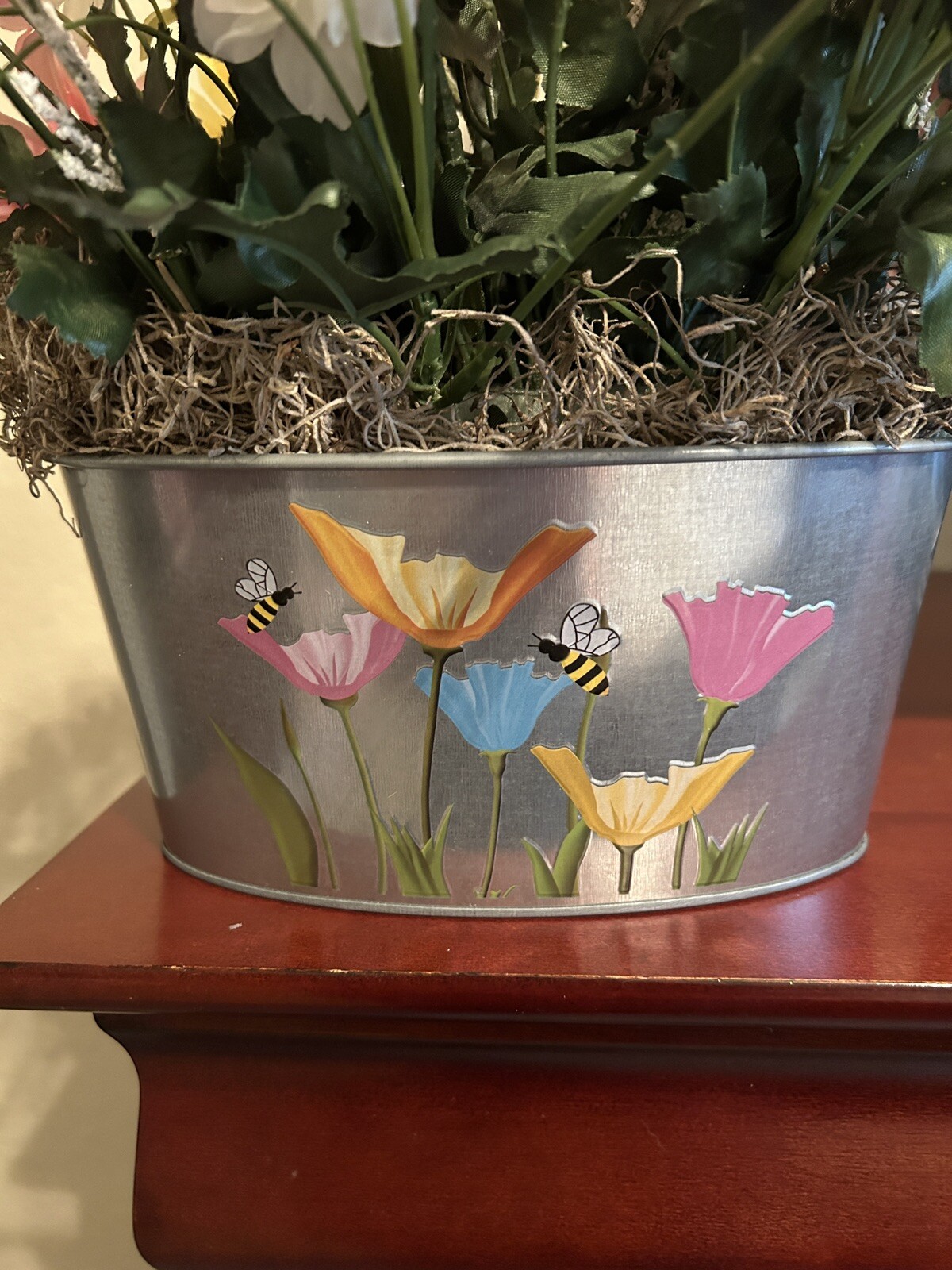 Spring Flower Arrangement in a Silver Metal Canister with Flower and Bee Motif