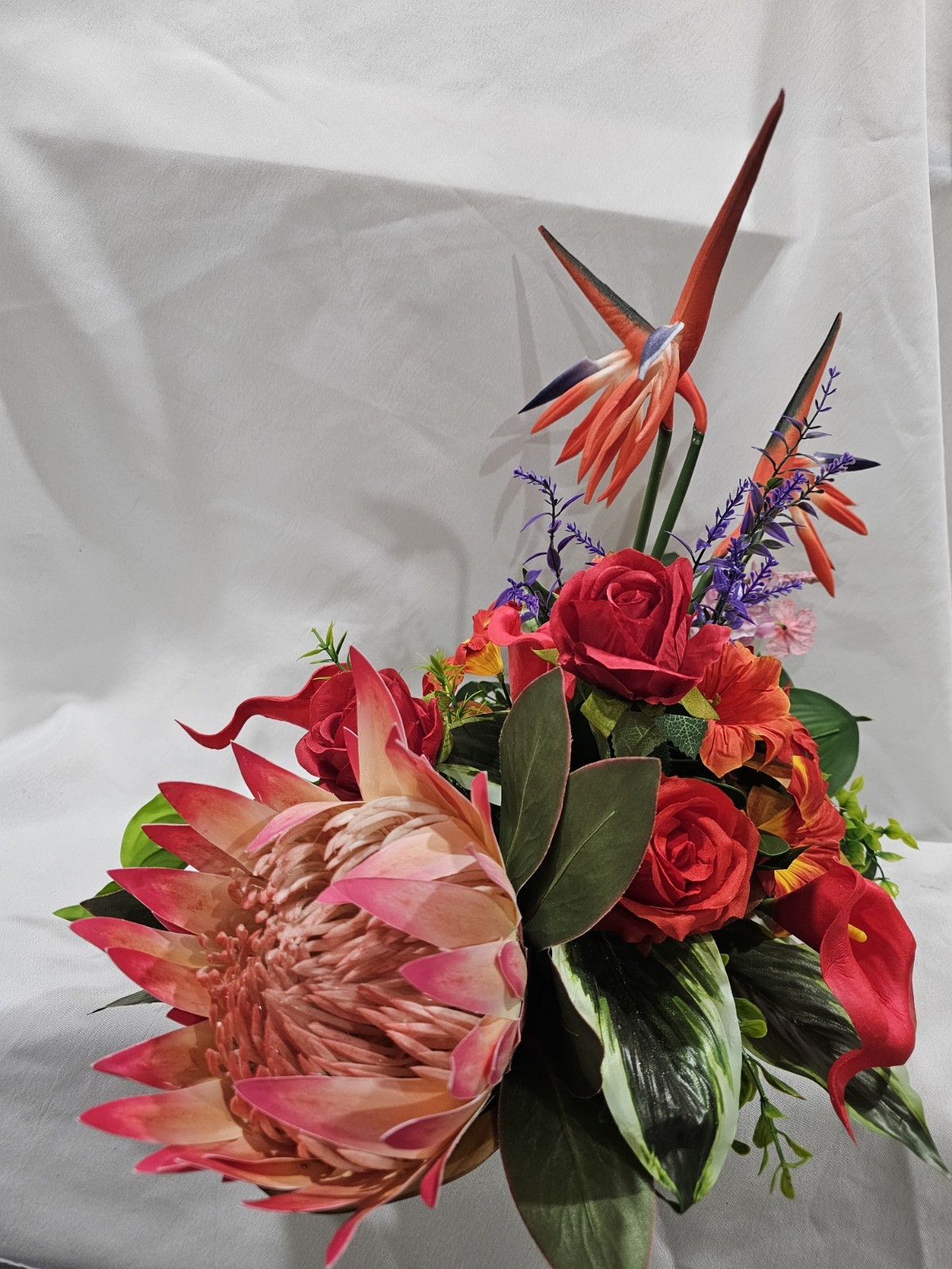 Bright Colors in this Artificial Tropical arrangement, Birds of Paradise etc.