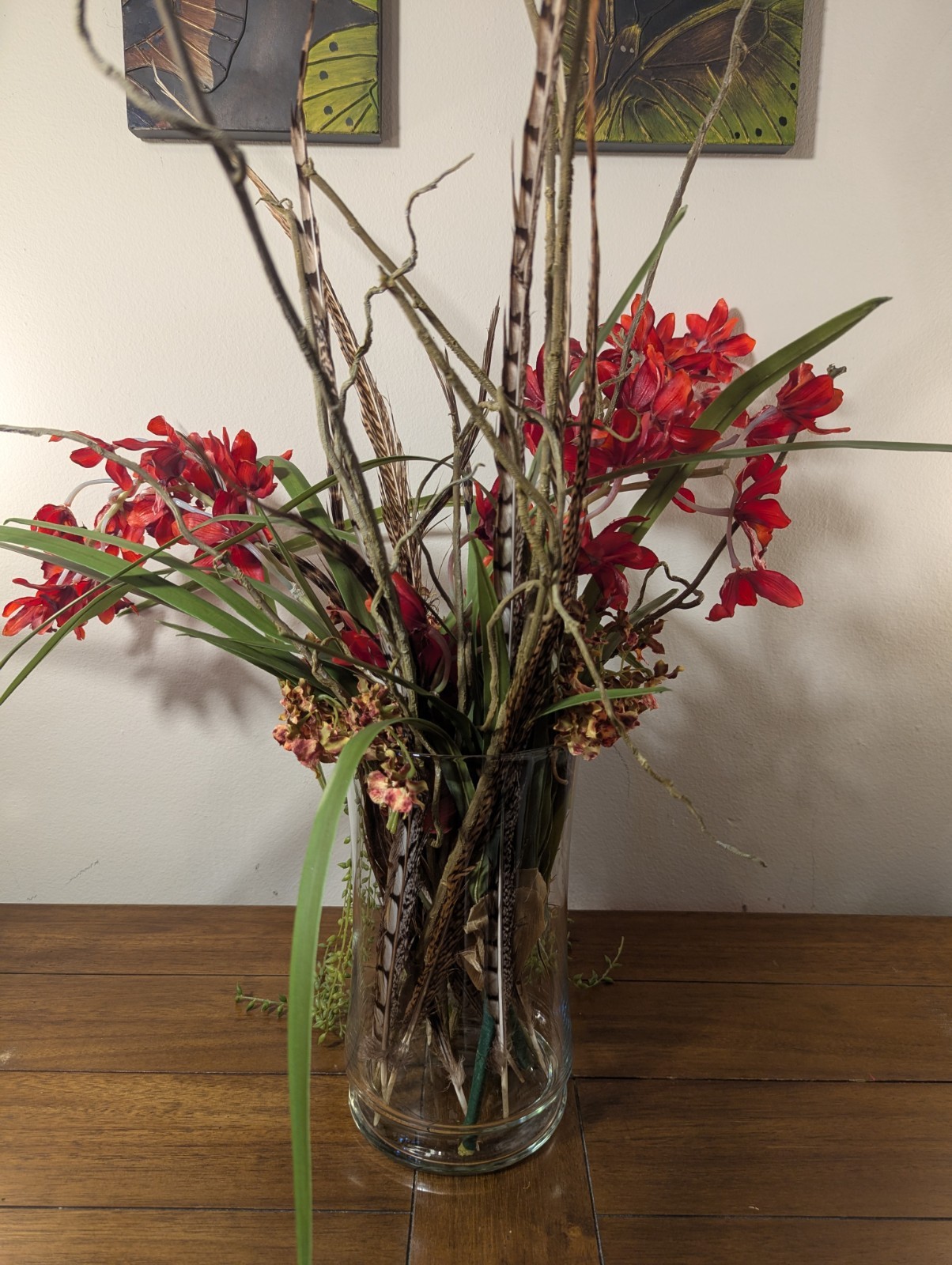 Faux Floral Arrangement With Clear Circular Vase Red Orchards Trailing Greenery