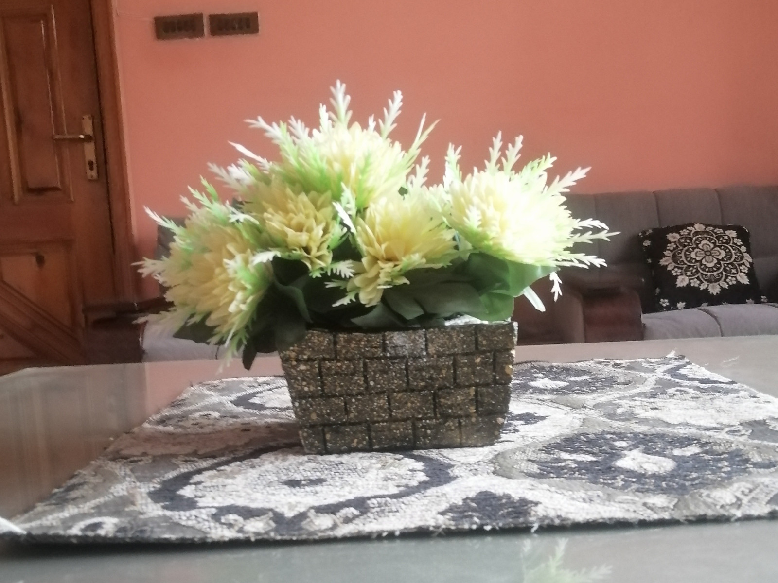 Artificial Flower Arrangement in Decorative Brick-Style Pot – 5″ x 5″ Pre-Owned