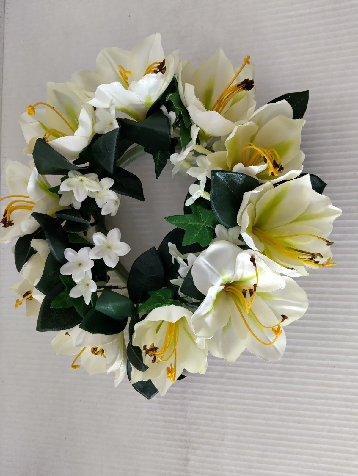 Amaryllis candle ring for a 6″ pillar candle or cremation urn.