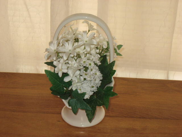 WHITE & GREEN FLOWERS IN A WHITE PORCELAIN BASKET