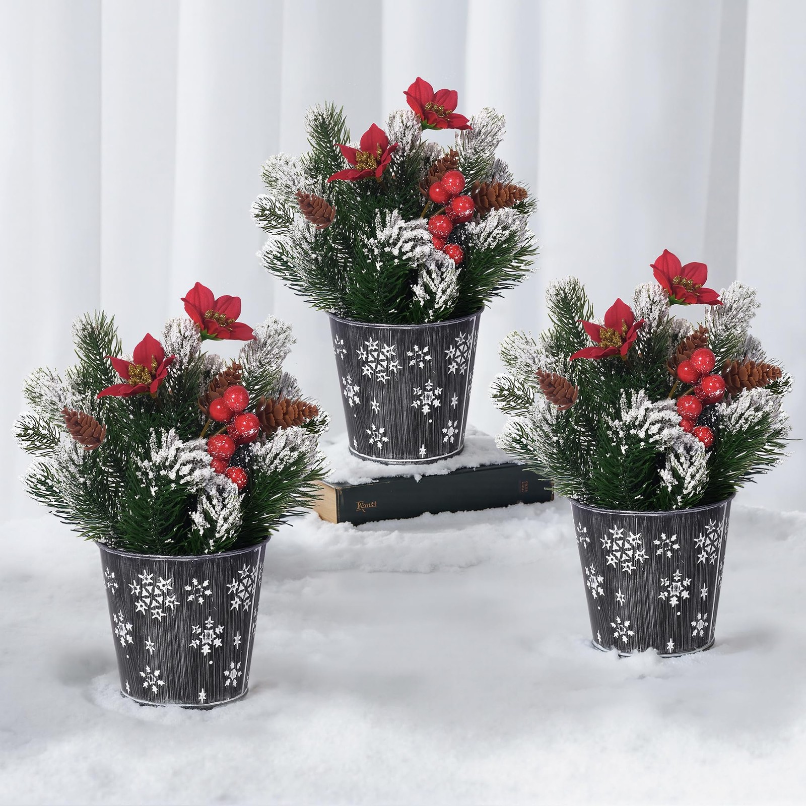 Potted Snowy Norfolk Pine Branches with Poinsettias Barries and Pin Cones