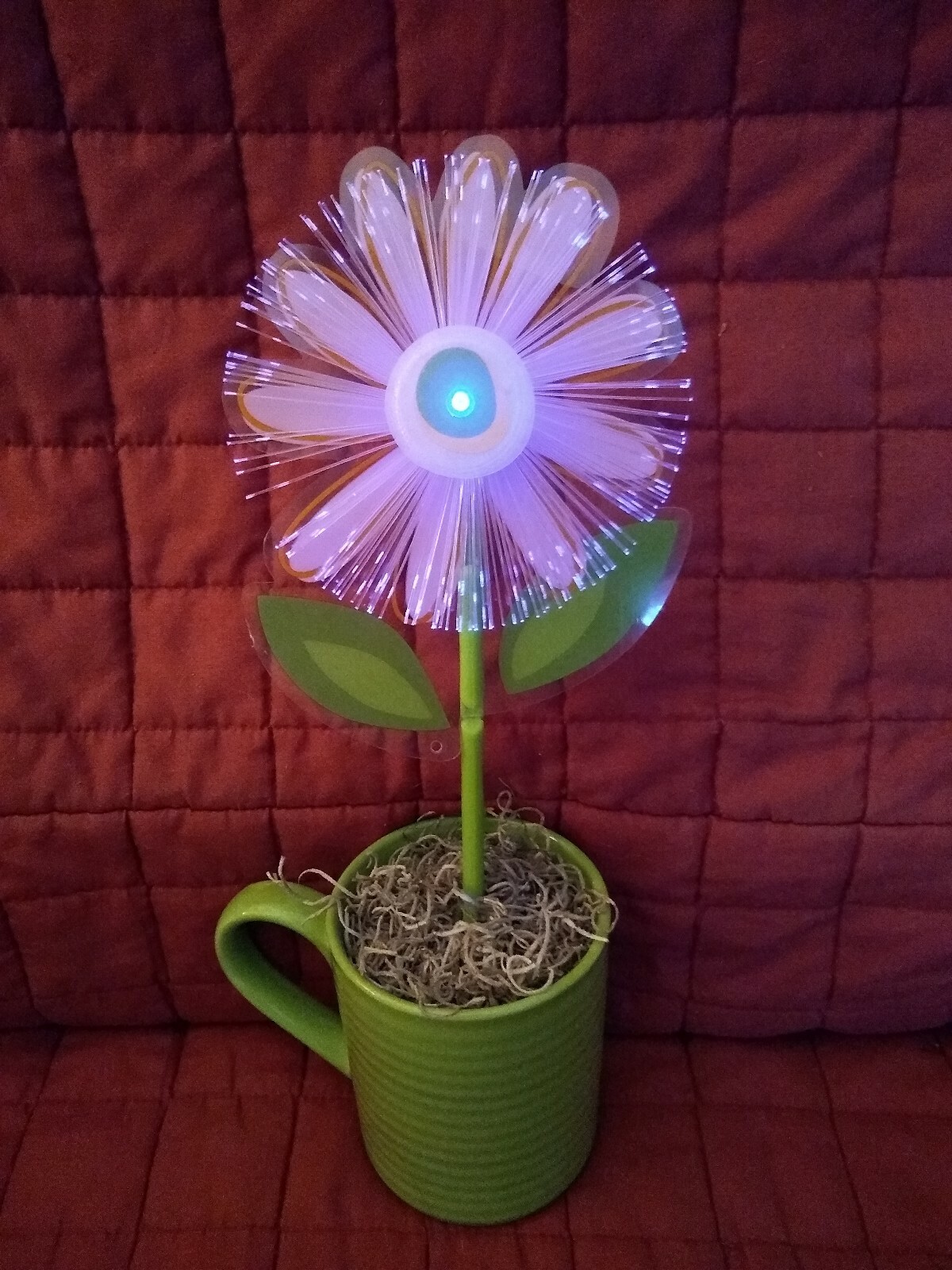Fiber Optic Color Changing Plastic Flower Daisy in a Green Ceramic Mug Pot