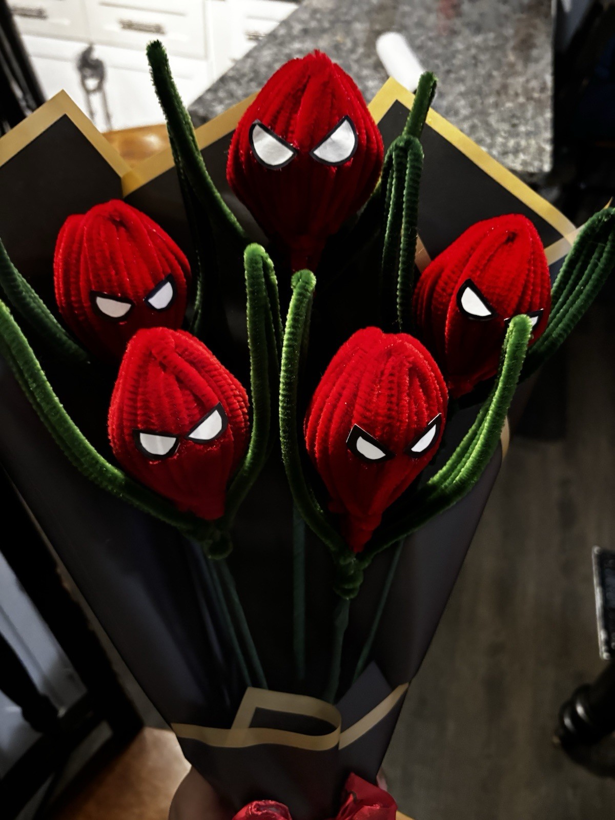 Artificial Spider-Man Themed Red Flower Bouquet with Black Wrap and Red Bow