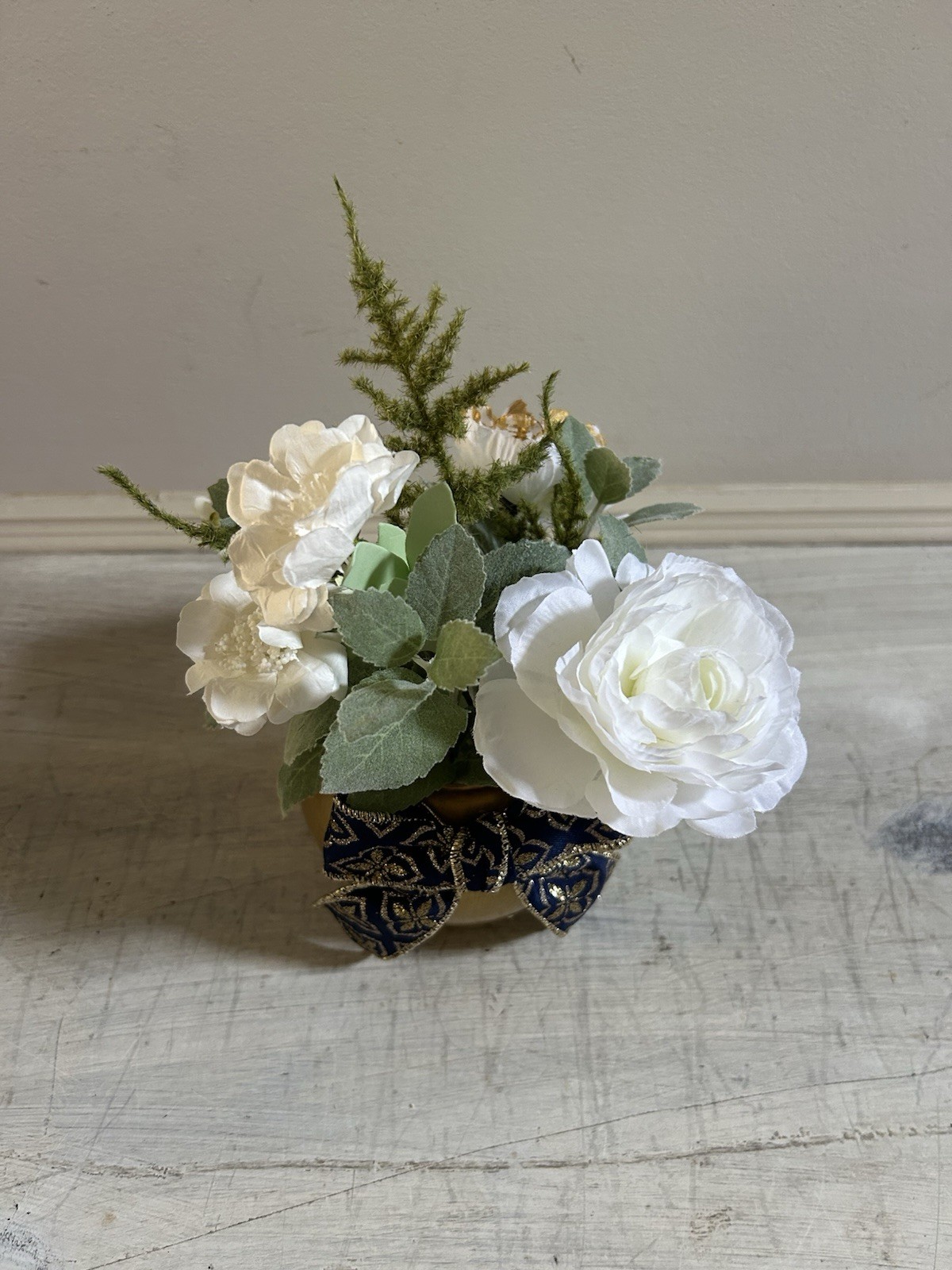 Sage Green White And Gold Floral Arrangement With Navy And Gold Bow