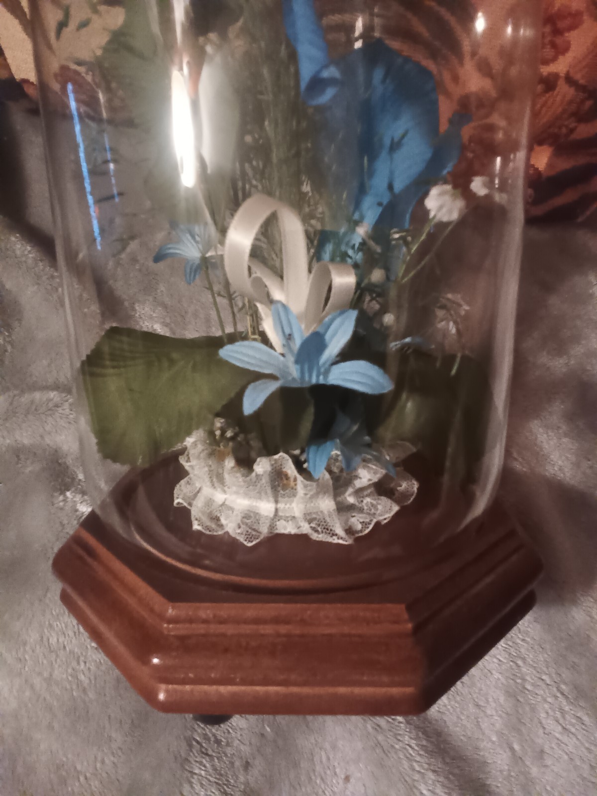 Glass dome blue,green and white artificial flower arrangement,wood base.