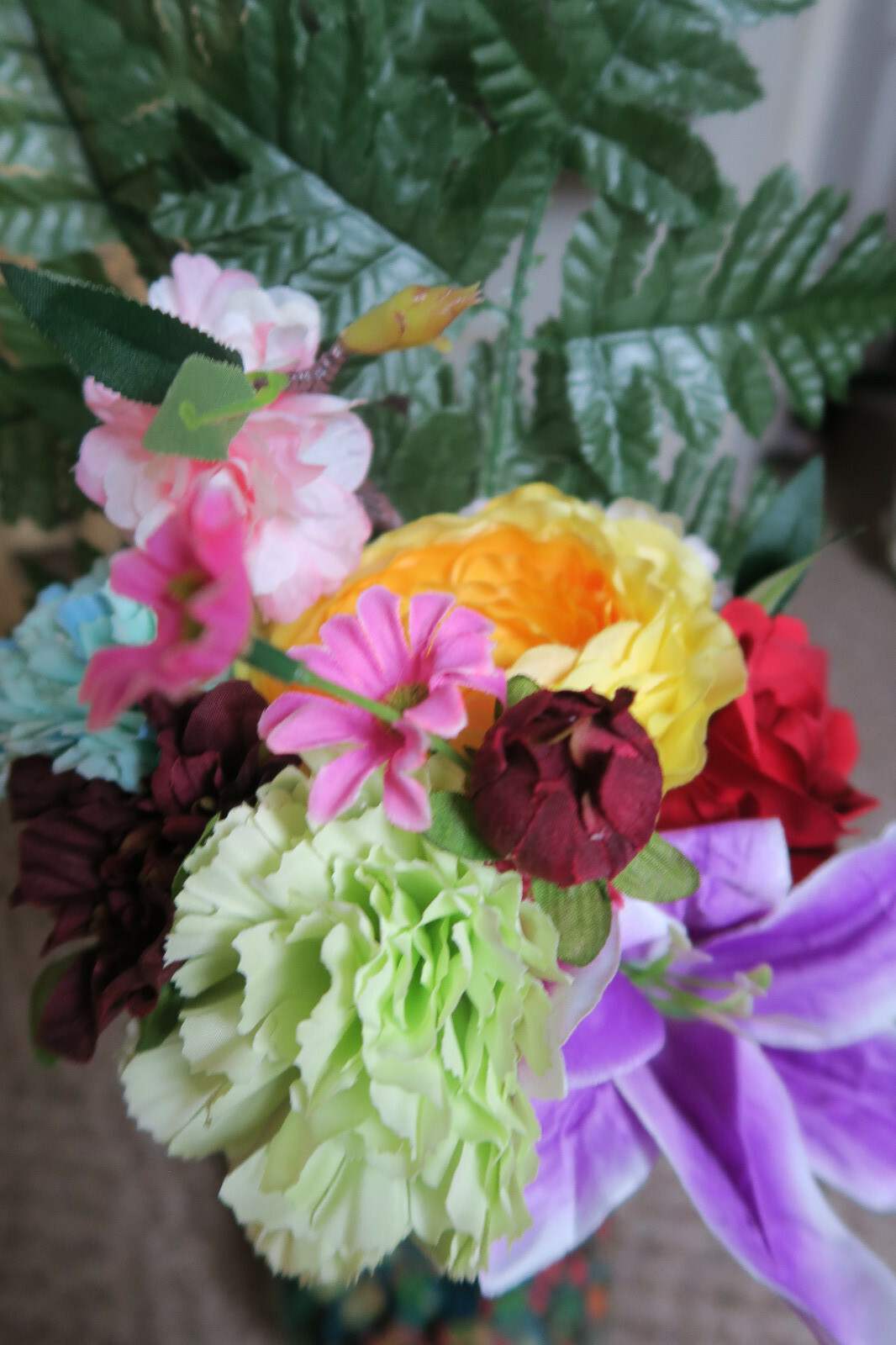 Artificial Flowers With Clear Vase And River Rocks