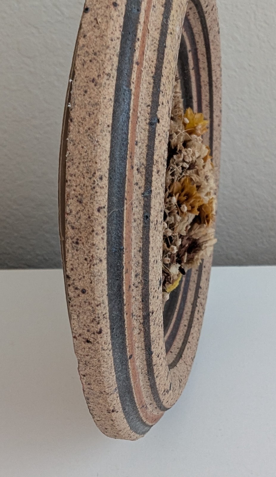 Dried flowers wall hanging round pottery circle speckled floral art boho fall