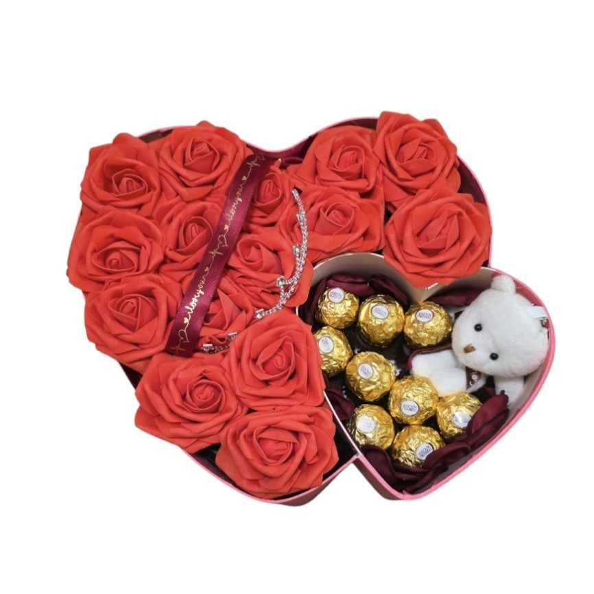 Eternal red flowers with a box in the shape of a pink heart, chocolate/bear.